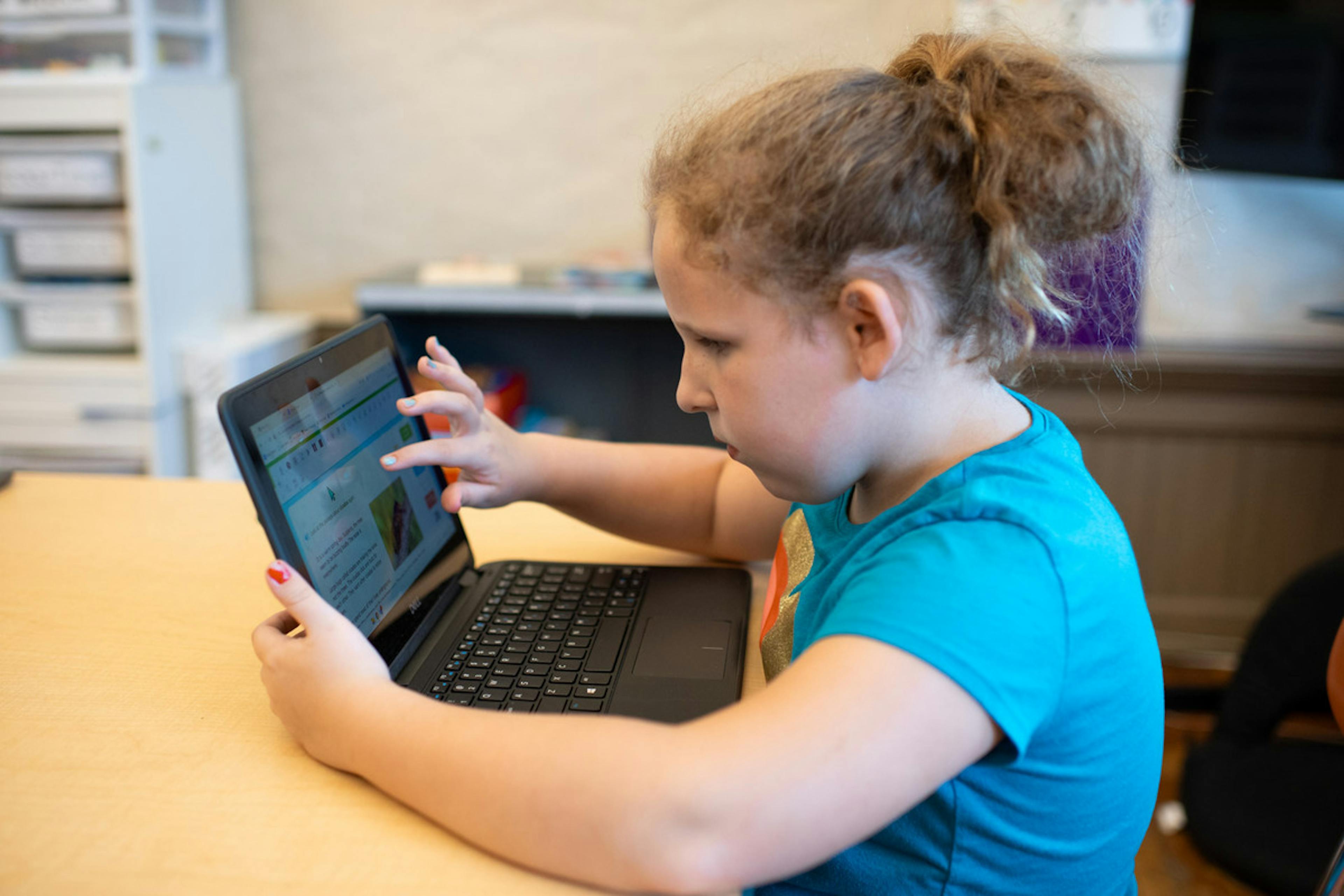 A student using a laptop