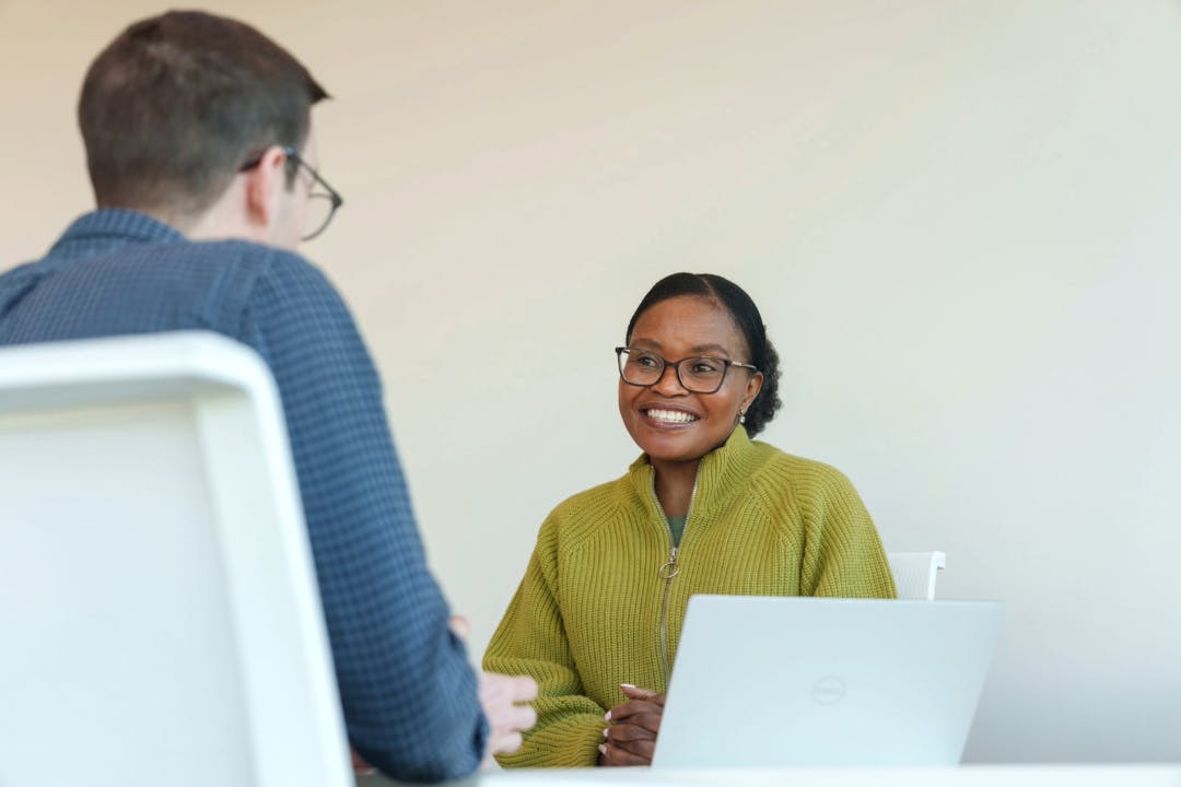 Two individuals in an interview scenario