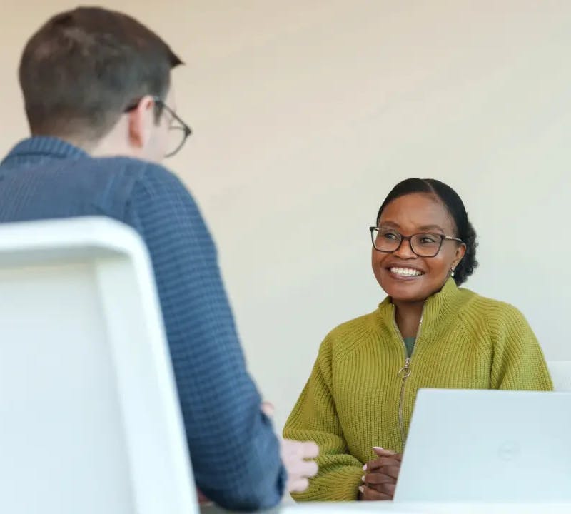 Two individuals in an interview scenario