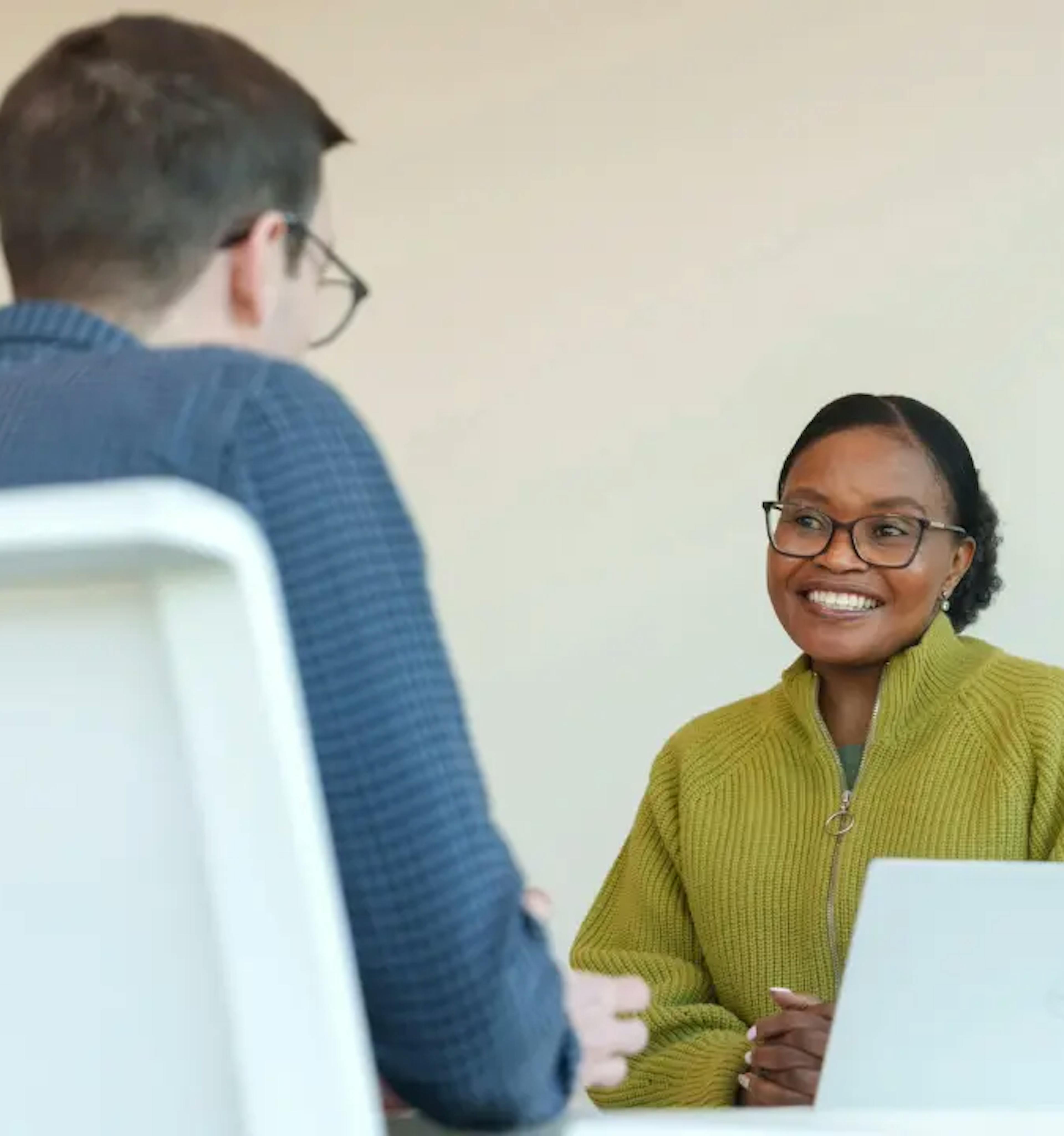 Two individuals in an interview scenario