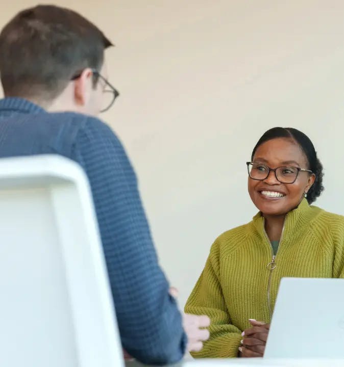 Two individuals in an interview scenario