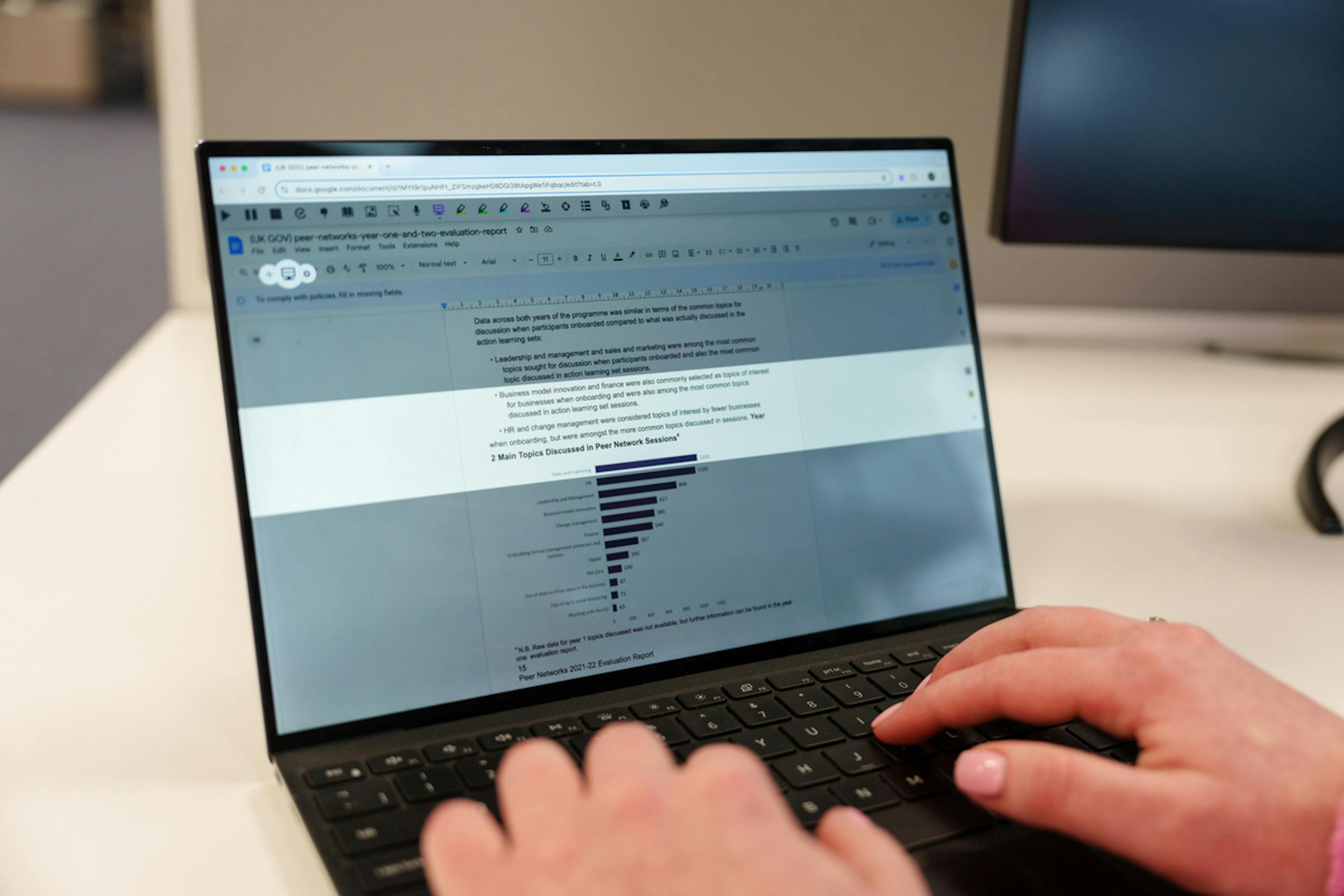 A person using Screen Masking on Read&Write on a laptop
