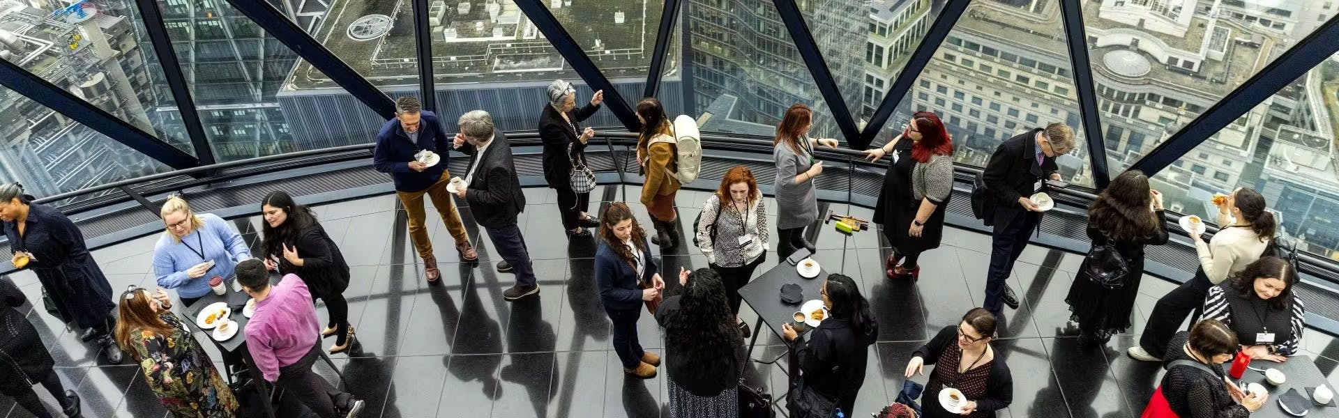 A group of professionals gathered at a workplace event in London