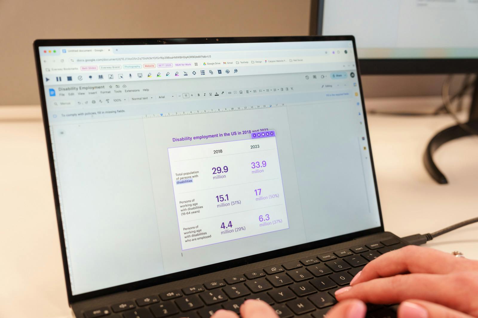 Someone using the Screenshot reader tool on Read&Write on a laptop