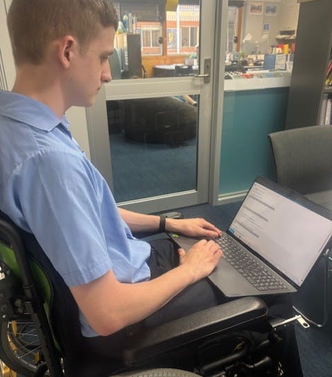 Hamish using Equatio on his laptop