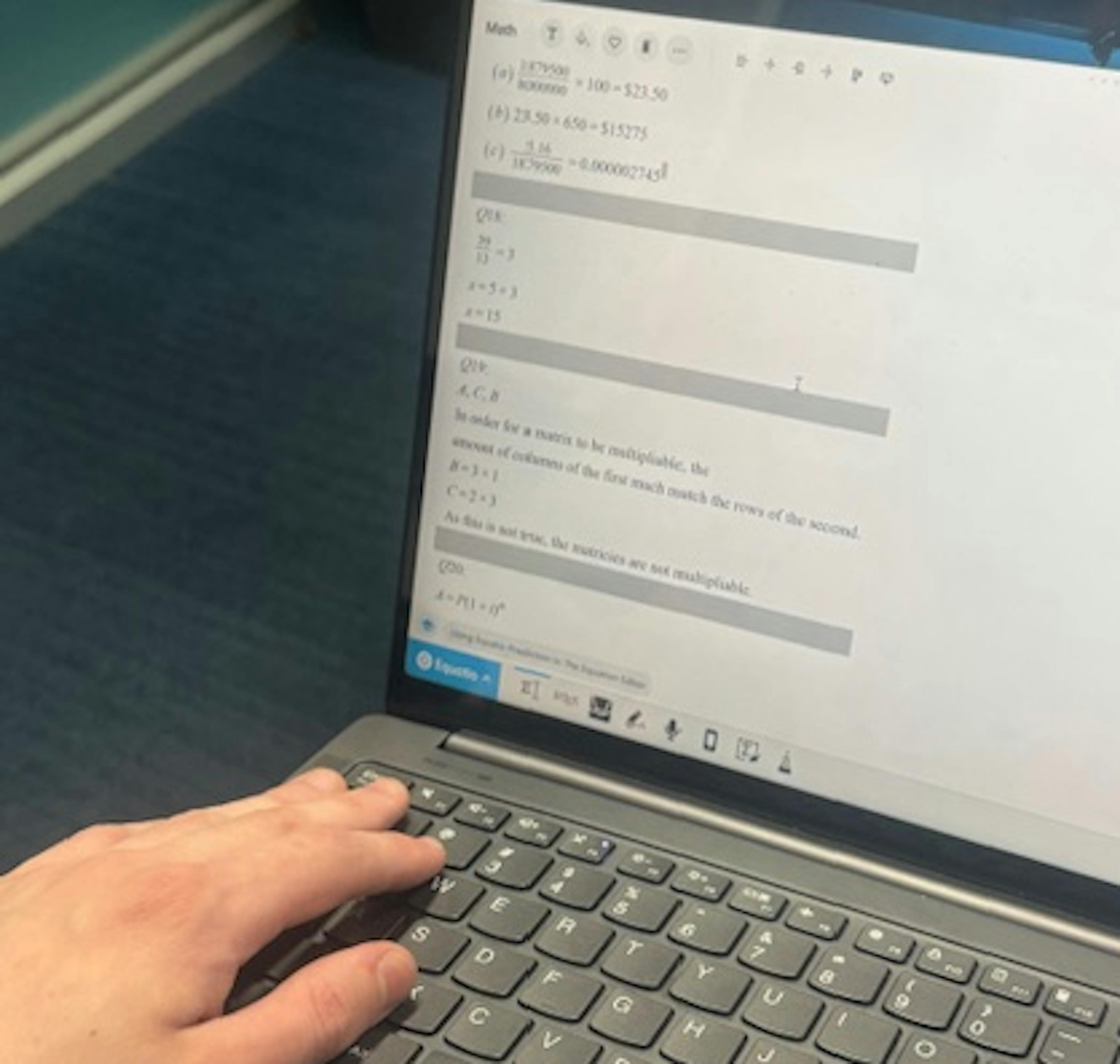 Hamish using Equatio on his laptop