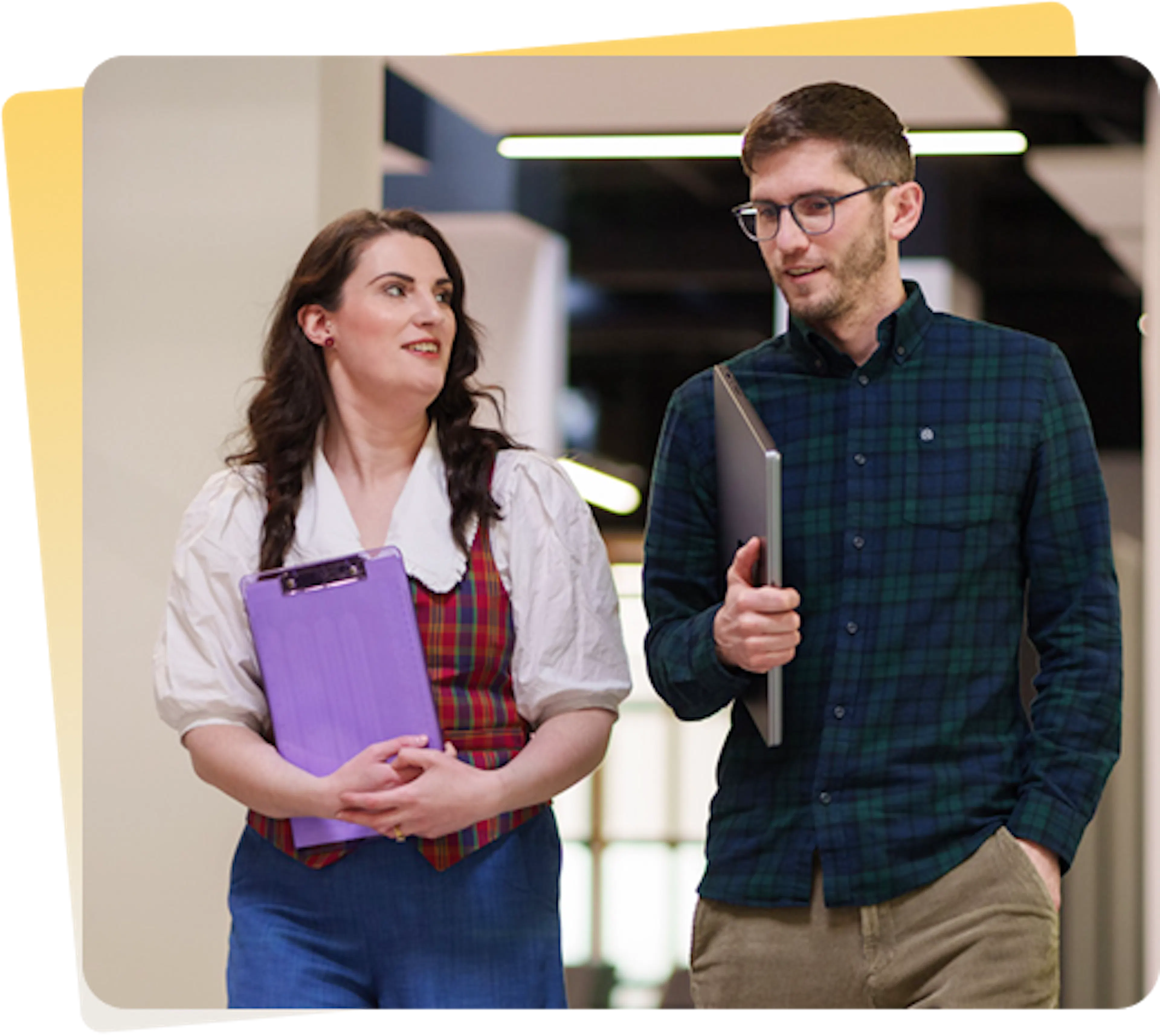 Two Everway employees walking in an office 