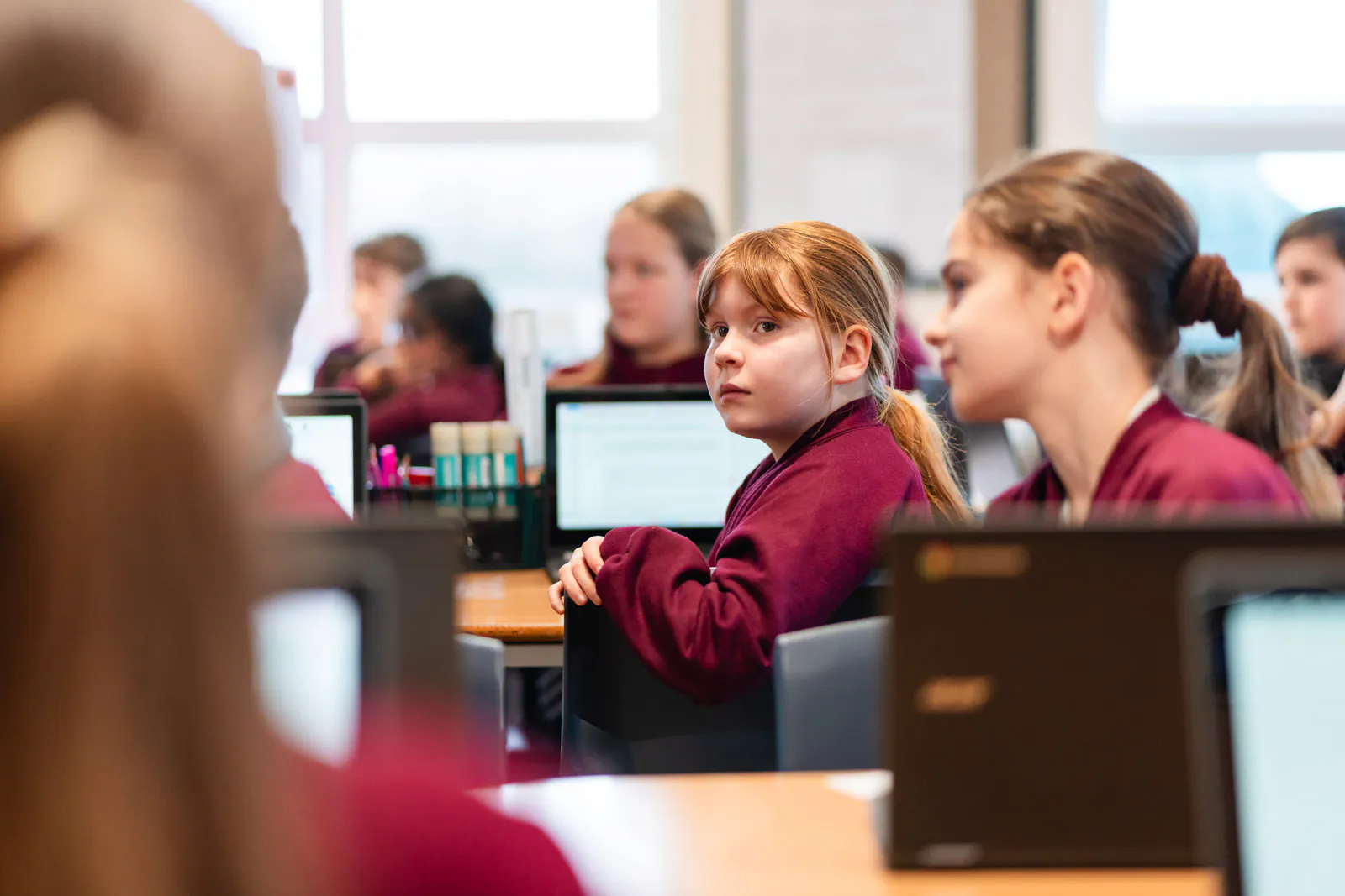 Group of students in a room with laptops