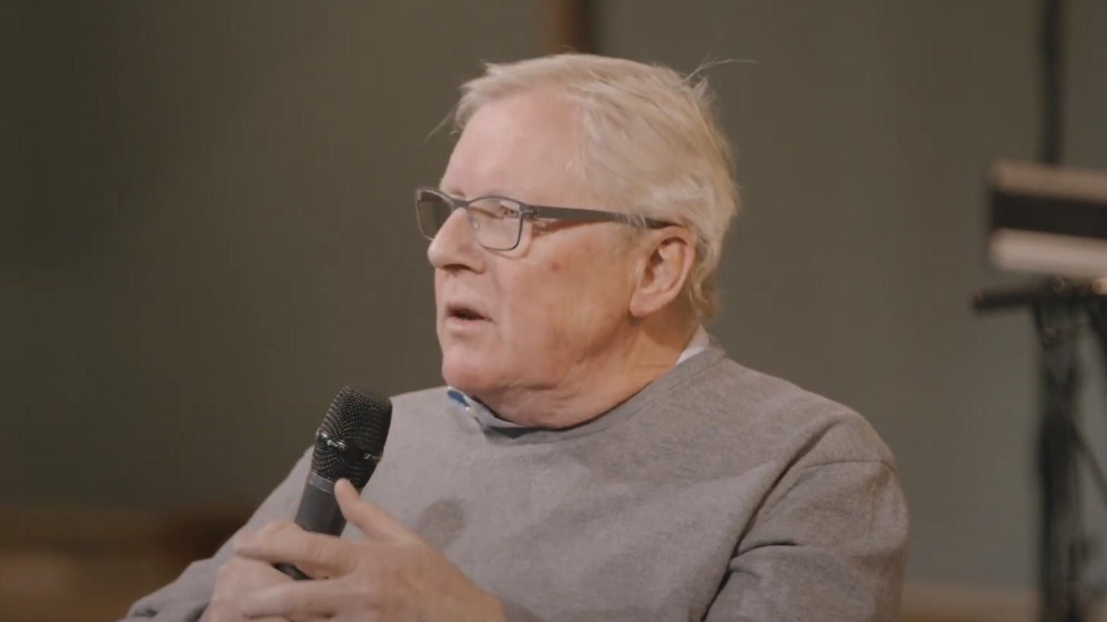 Paul Coleridge speaking into a microphone