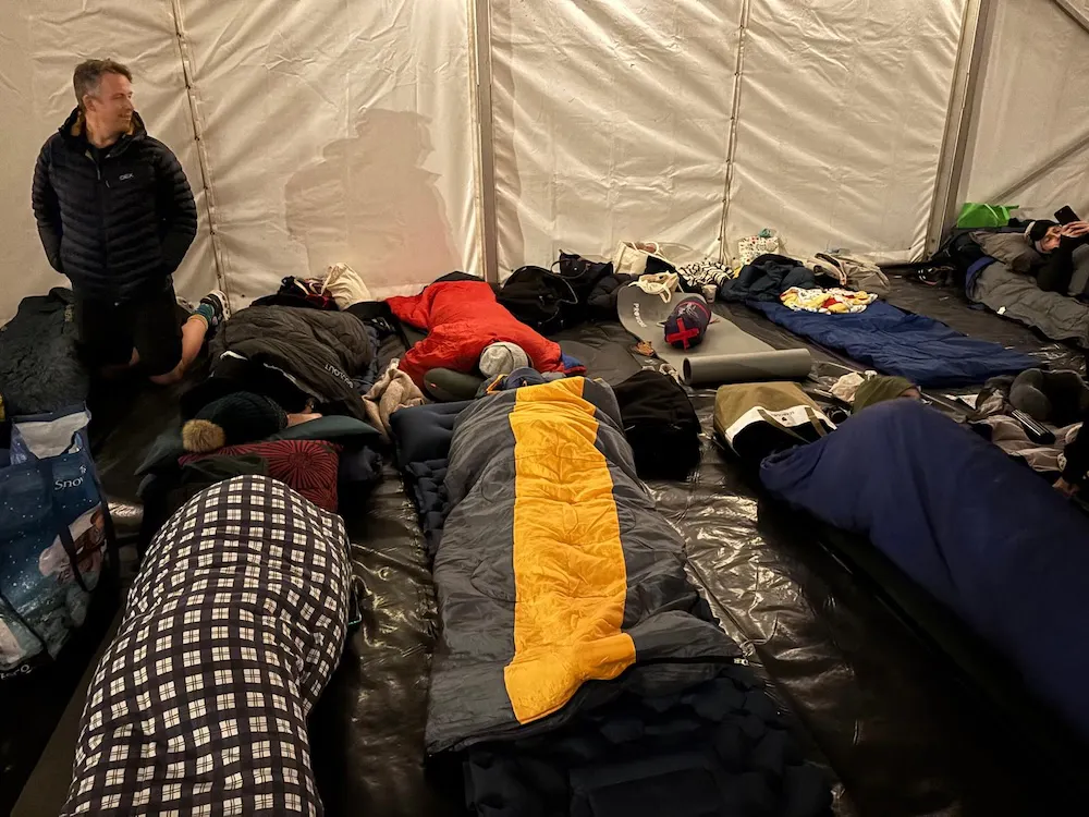 Sleeping bags laid out inside a marquee during a charity sleep out.