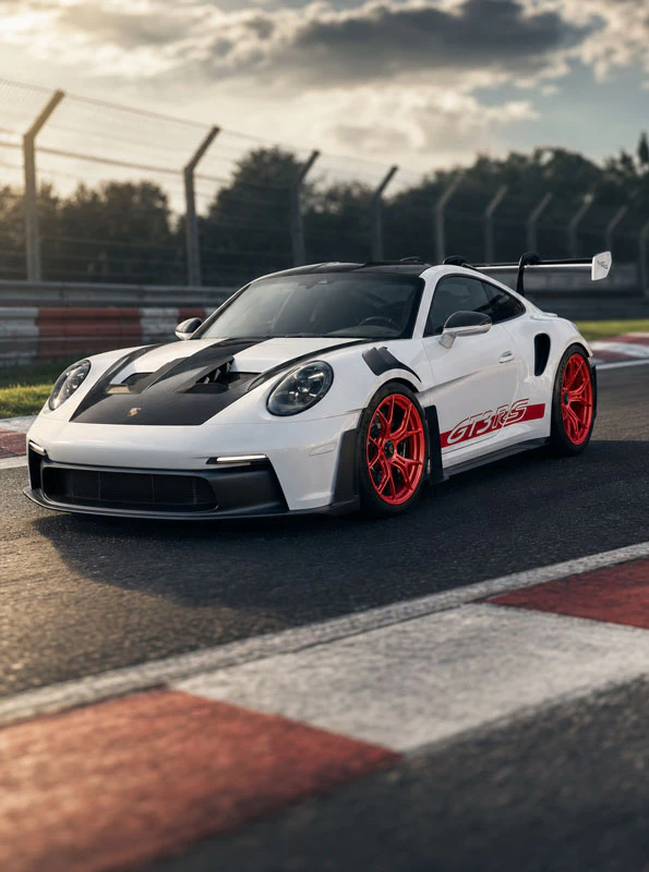Porsche on red wheels, close up on a racetrack