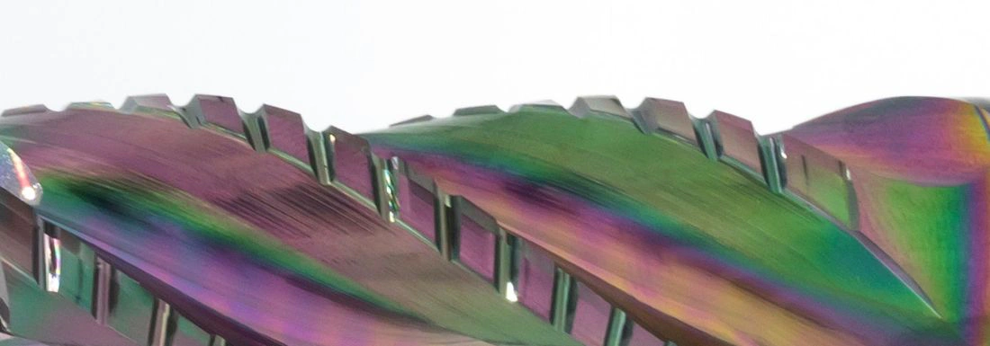 A close up of a carbide chip breaker end mill