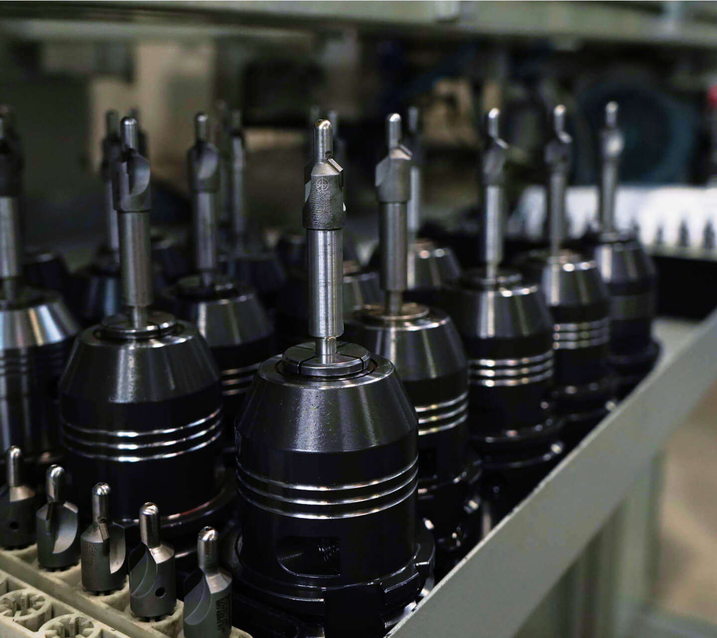 A metal tray containing multiple drill bits