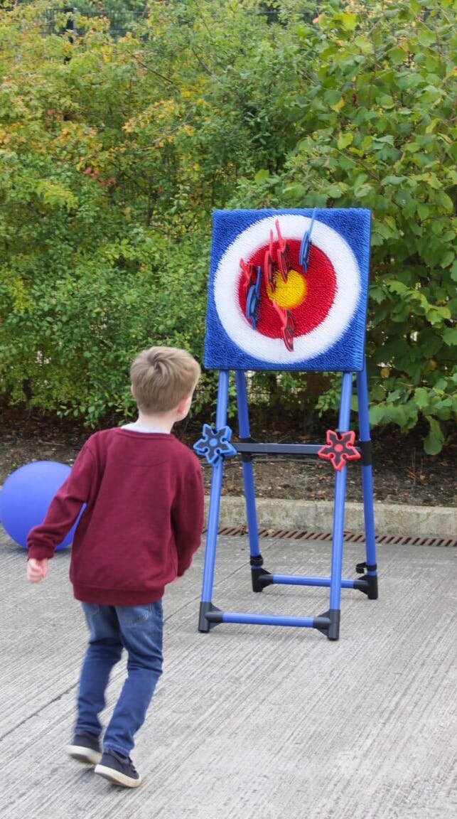 A photo from the Exactaform family day showing a child playing a game