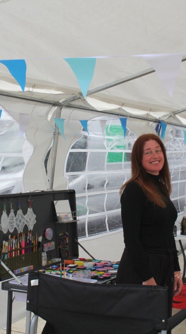 A photo from the Exactaform Family Day showing a woman at a stall.