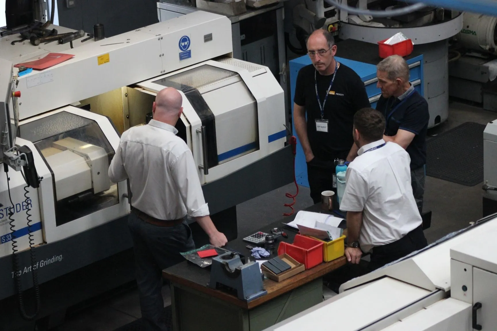 Jamie White guiding a factory tour in Exactaform