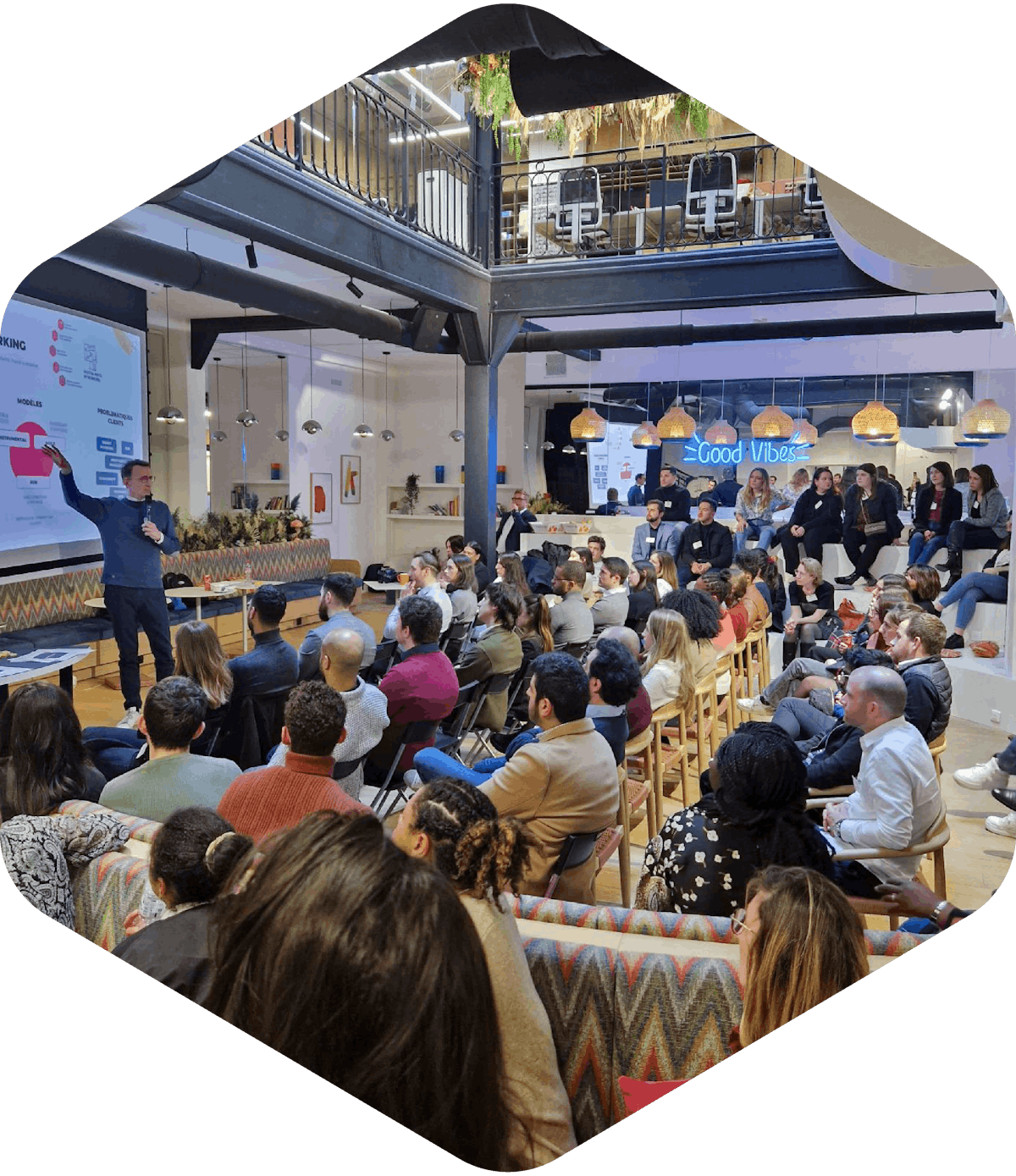 A group of people sitting and attending a conference.