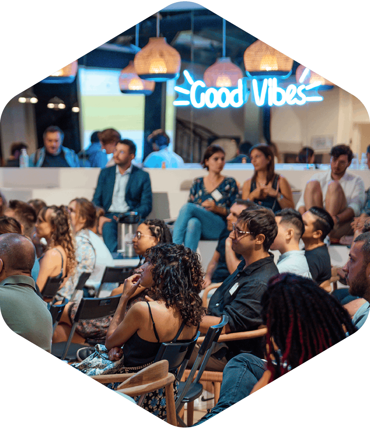 A group of people sitting and attending a conference.