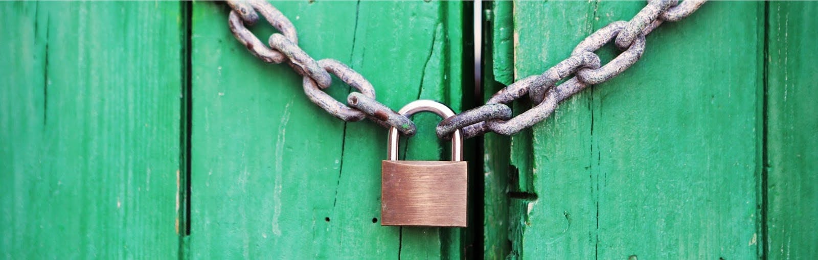 Security lock on green gate.