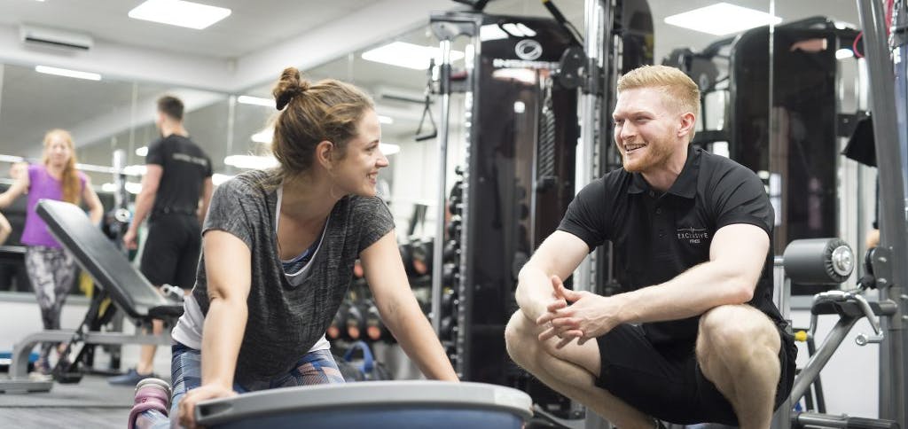 Personal trainer with client