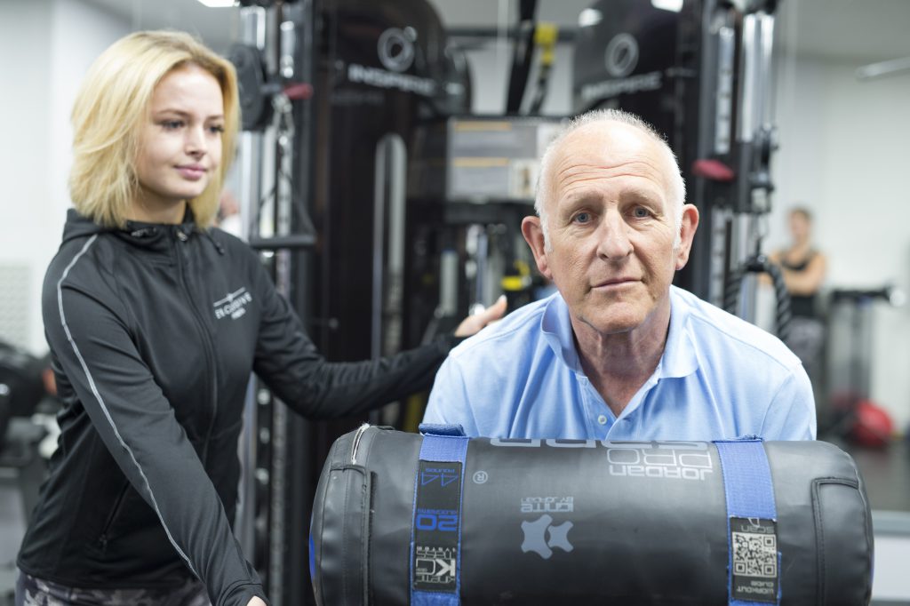 Simon Pentacost holding a 20kg weight