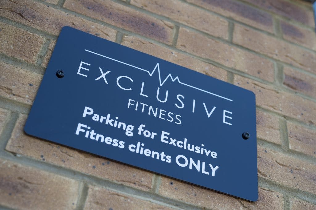 Exclusive Fitness - parking sign