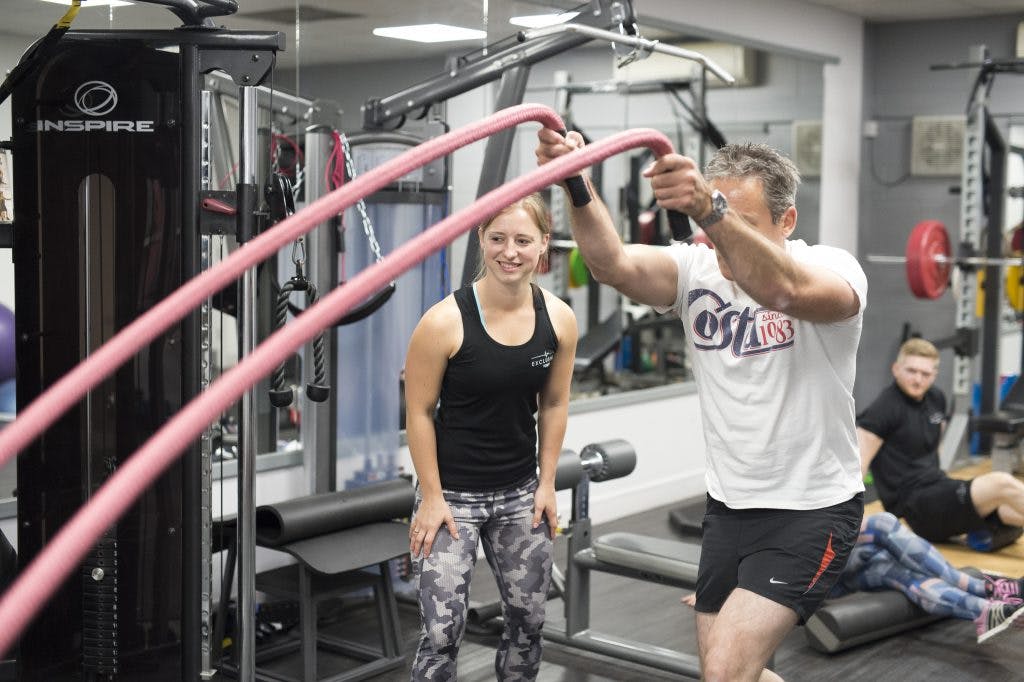 Exclusive Fitness trainer with client