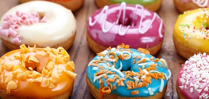 selection of colourful glazed ring doughnuts