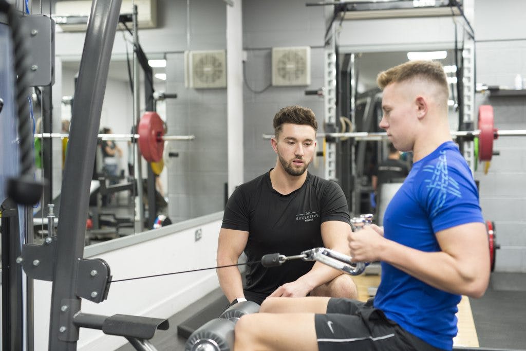 Exclusive Fitness trainer with client