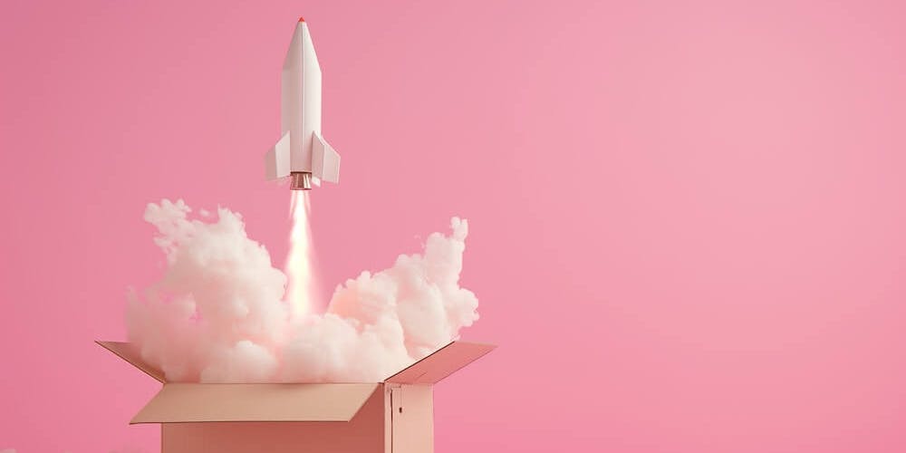 Rakete startet aus einem Karton vor pinkem Hintergrund Rakete startet aus einem Karton vor pinkem Hintergrund