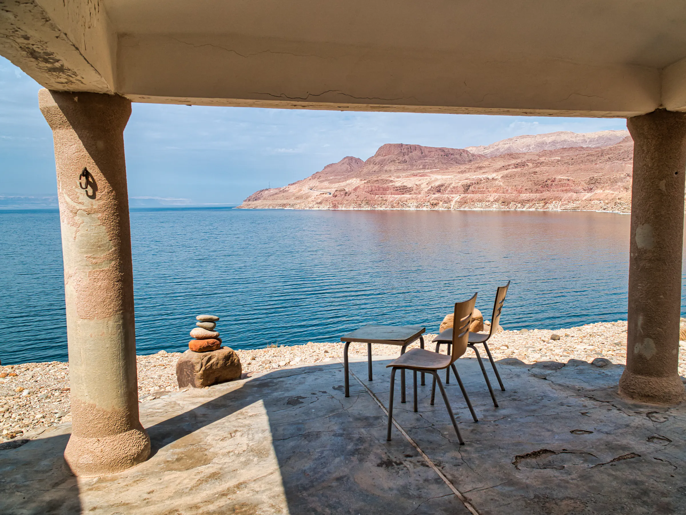 Chairs overlooking the Dead Sea and mountains in Jordan