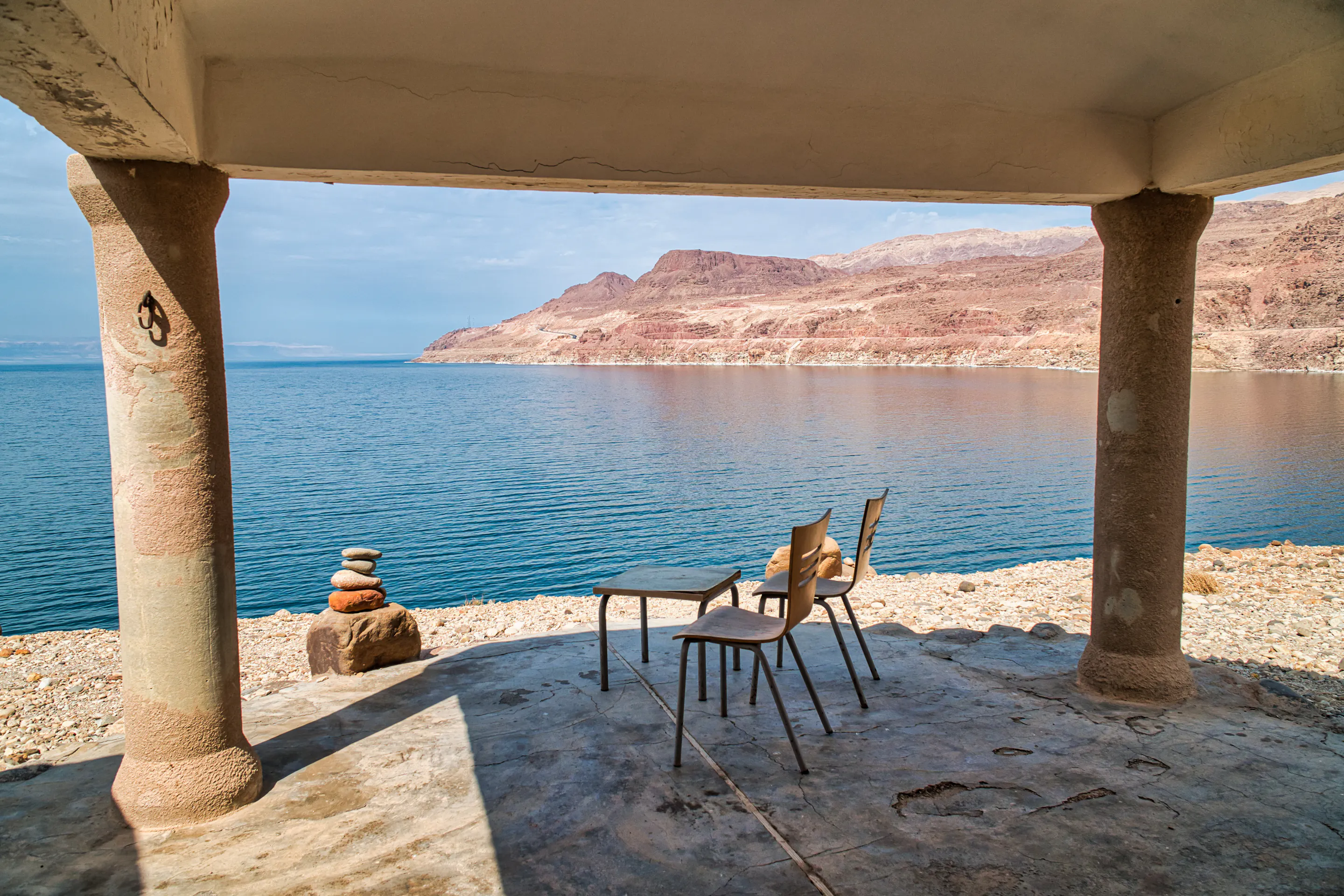 Chairs overlooking the Dead Sea and mountains in Jordan