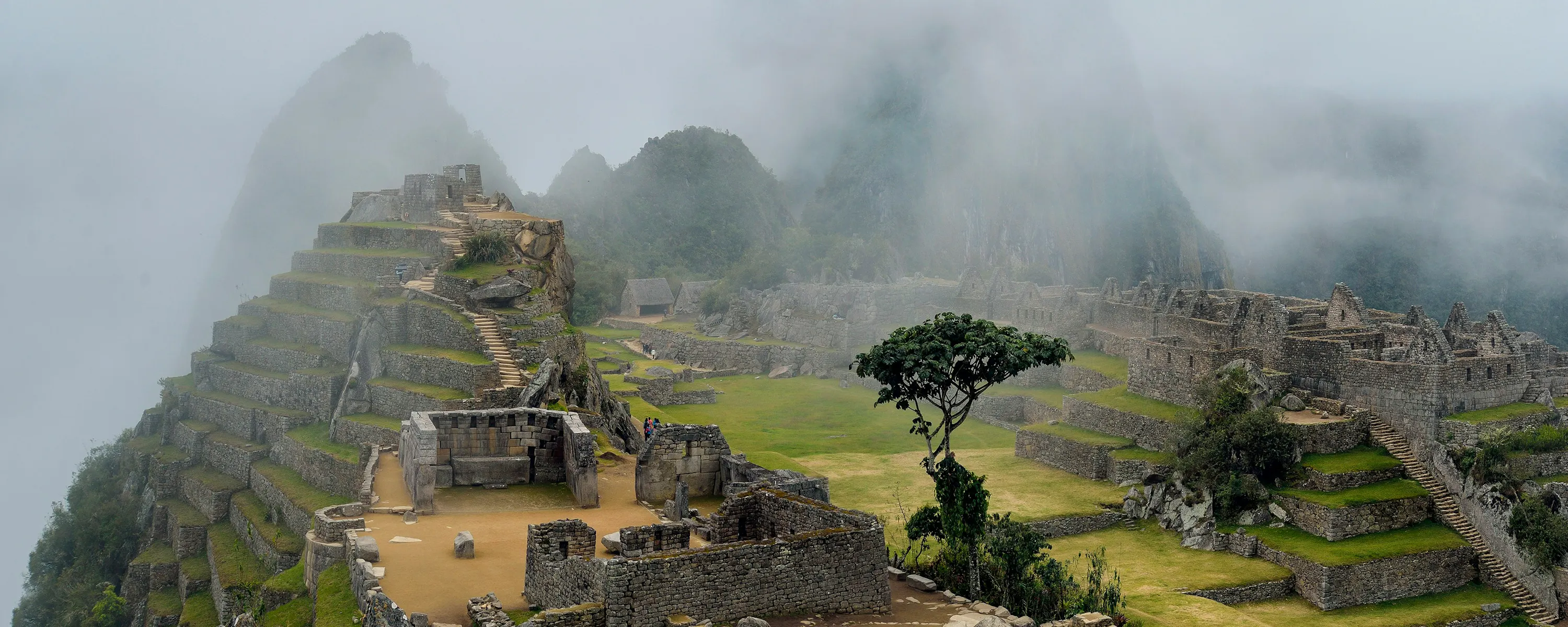 Misty clouds rolling over ancient Inca ruins, Machu Picchu Peru