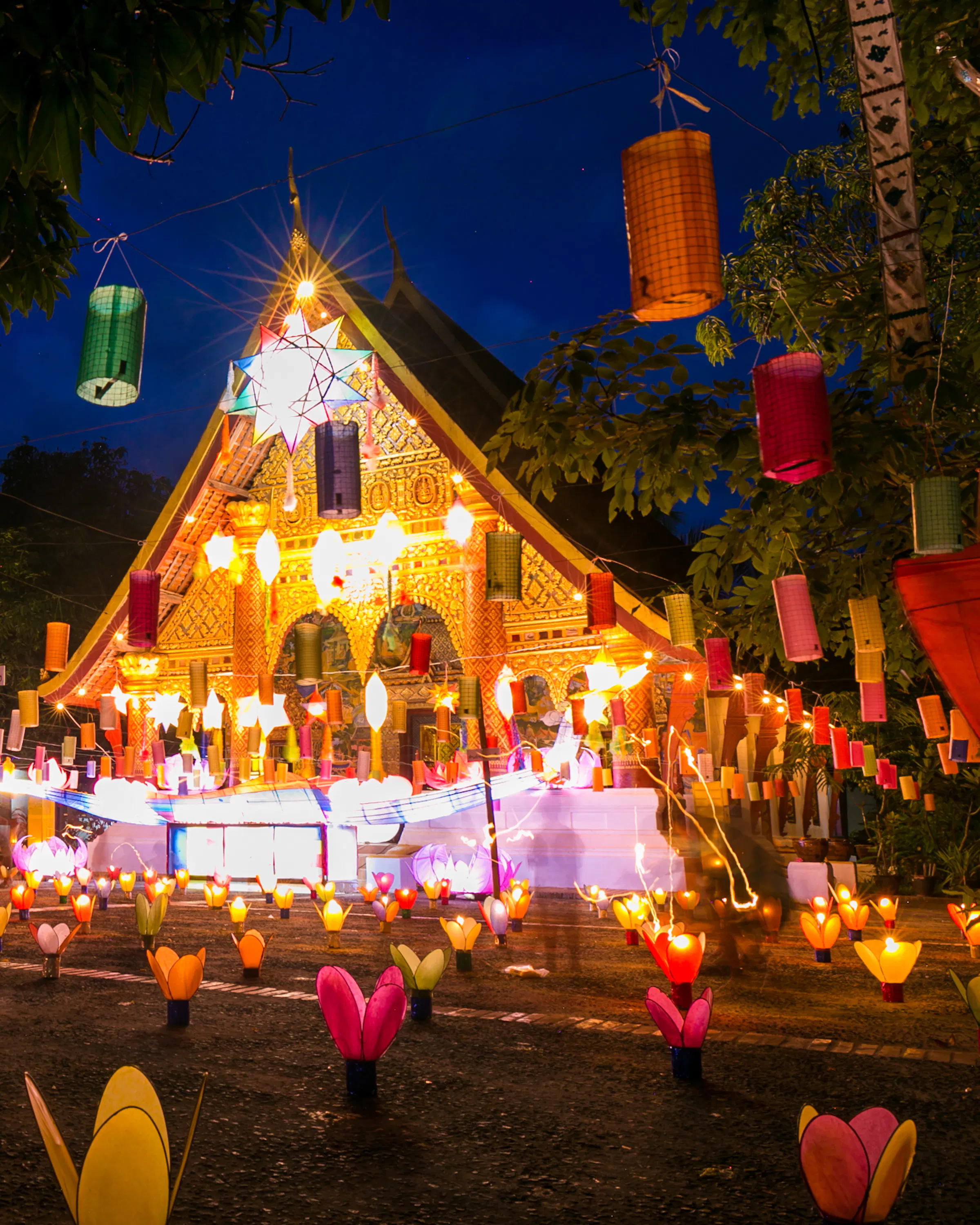 A temple in Laos is illuminated by lanterns during the Festival of Light
