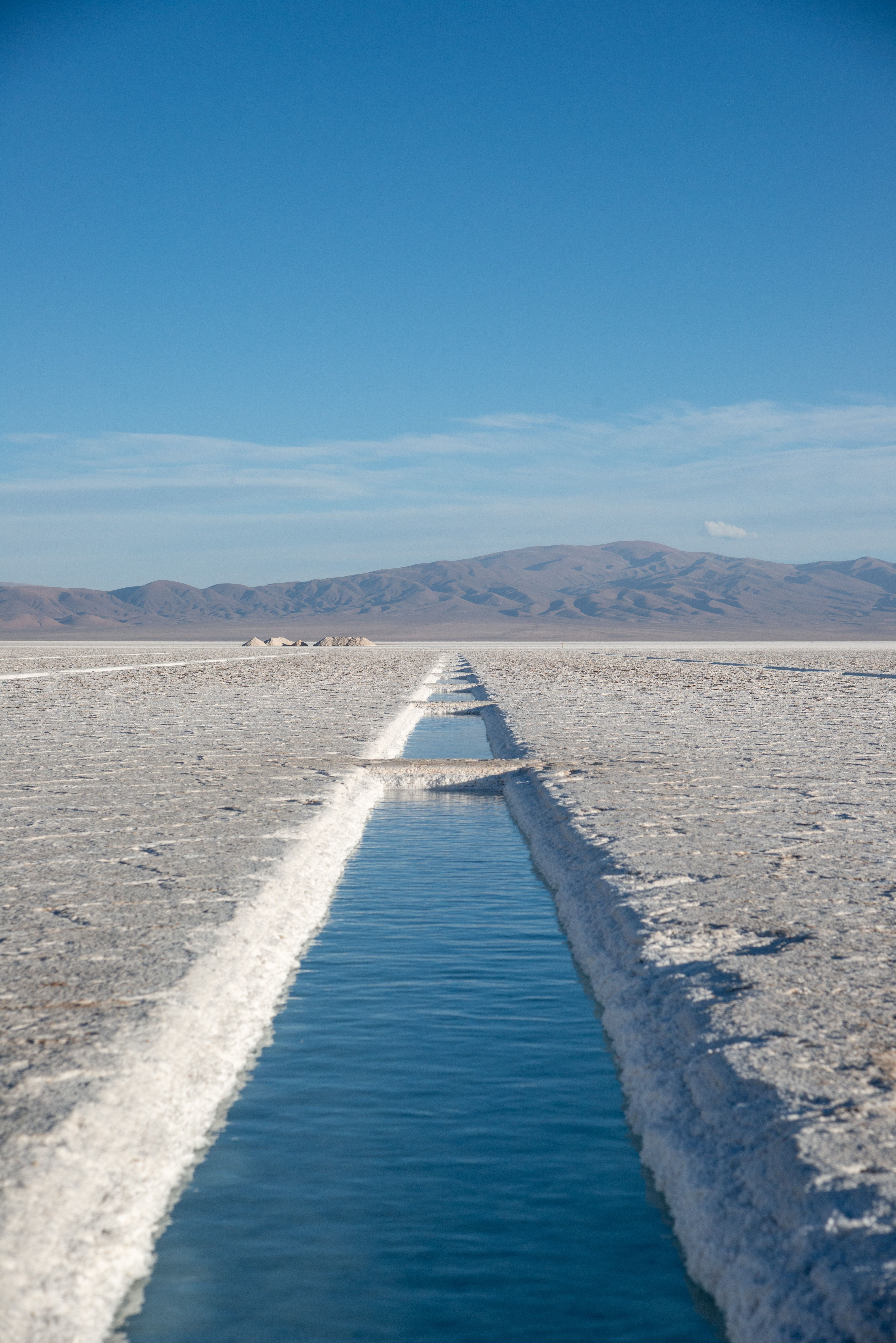 Salt water channel cutting through the Salinas Grandes salt flats near Salta, Argentina