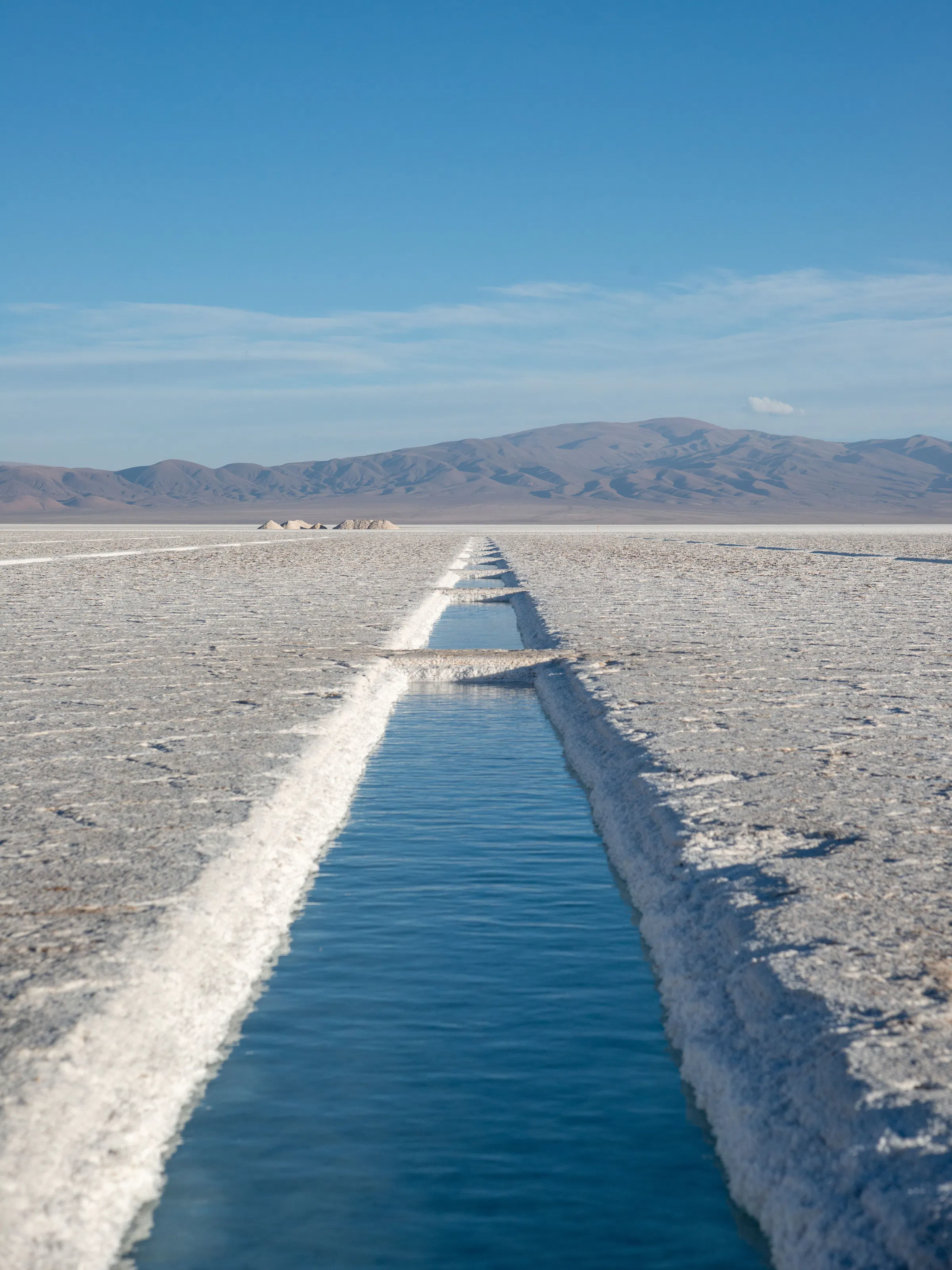 Salt water channel cutting through the Salinas Grandes salt flats near Salta, Argentina
