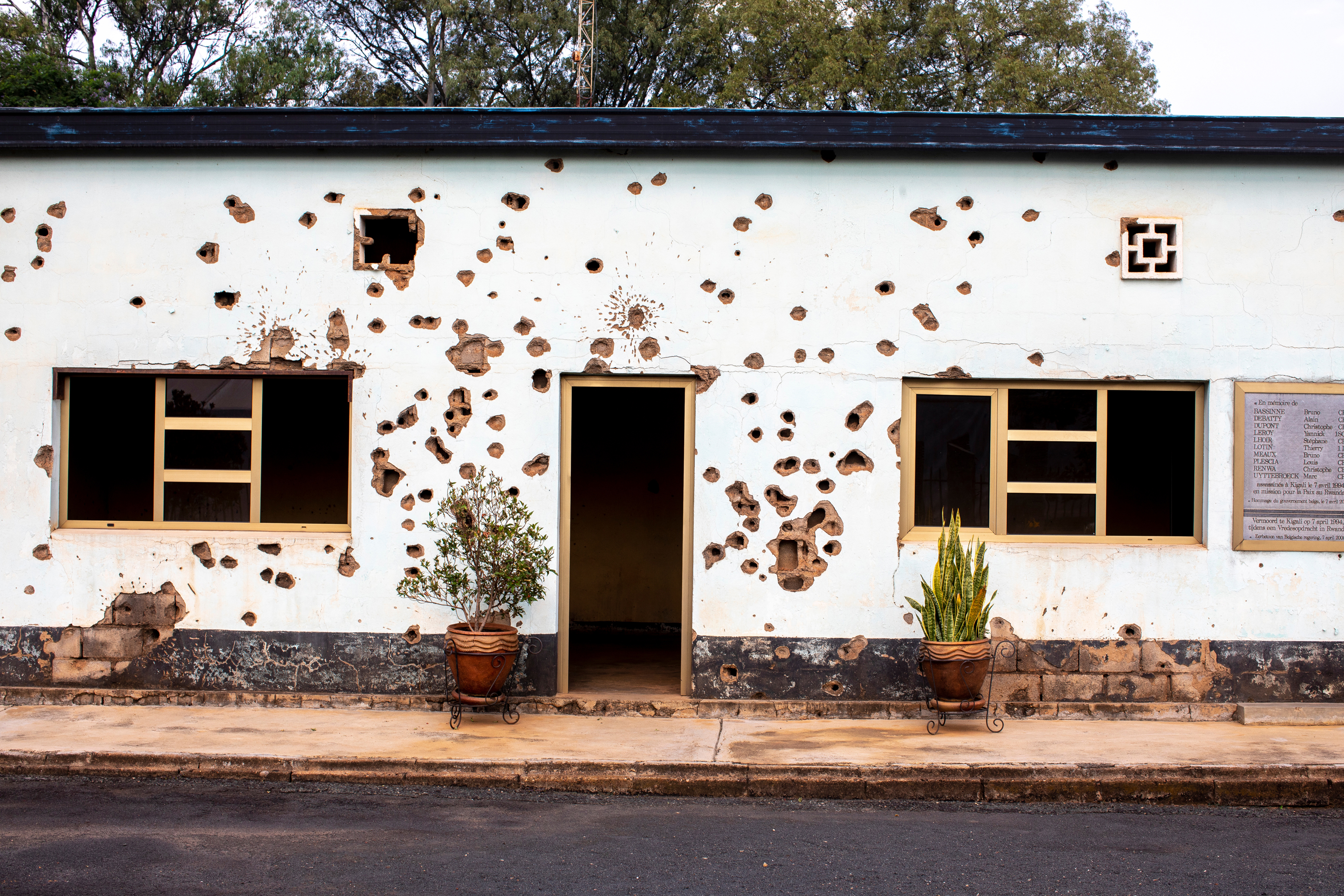 Bullet-scarred wall at the Camp Kigali memorial site in Kigali, Rwanda