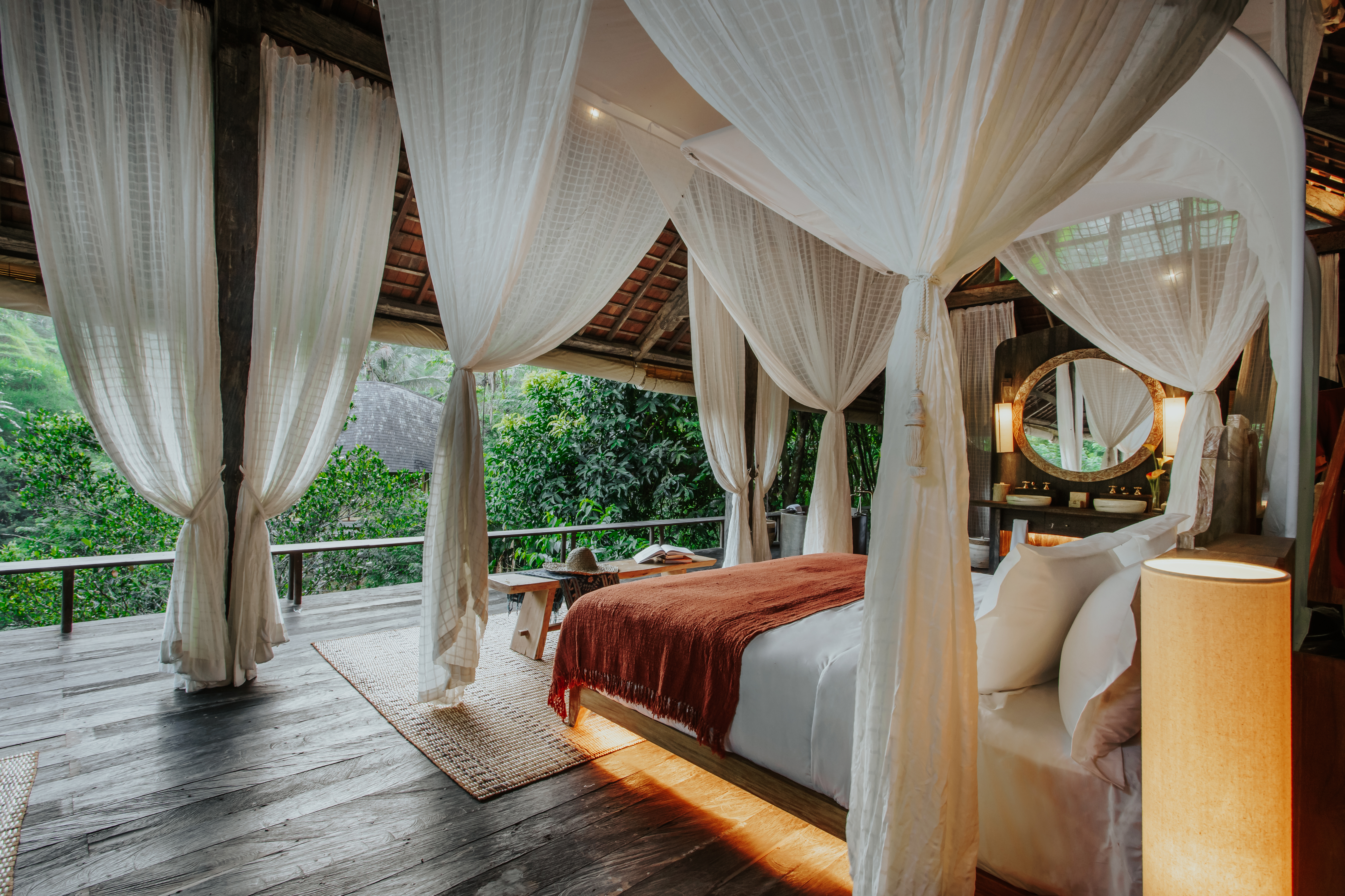 An open-air suite in Bali's northern Ubud highlands overlooks a dense jungle canopy.