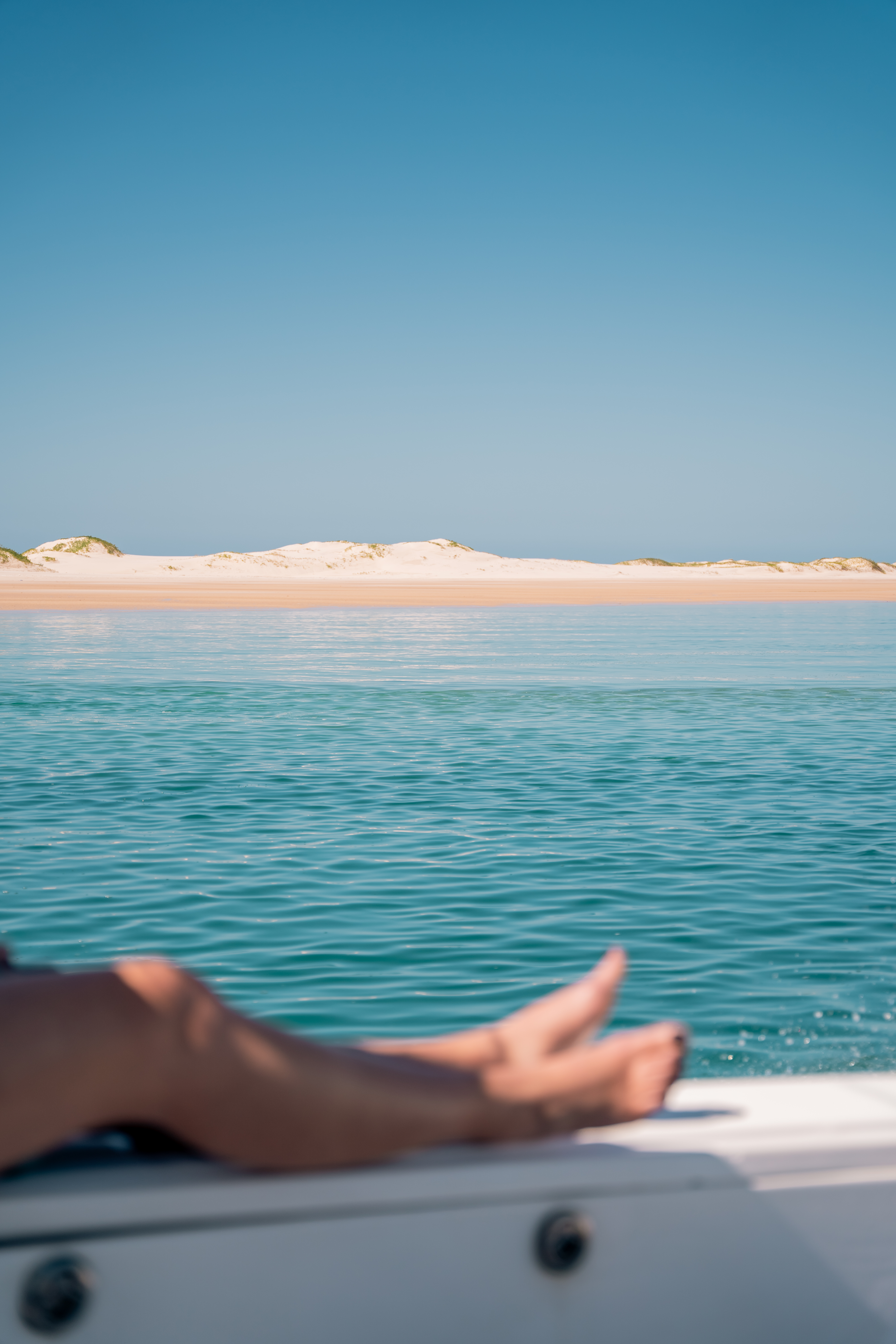 View of sand dunes from a boat on Bazaruto Archipelago waters, Mozambique