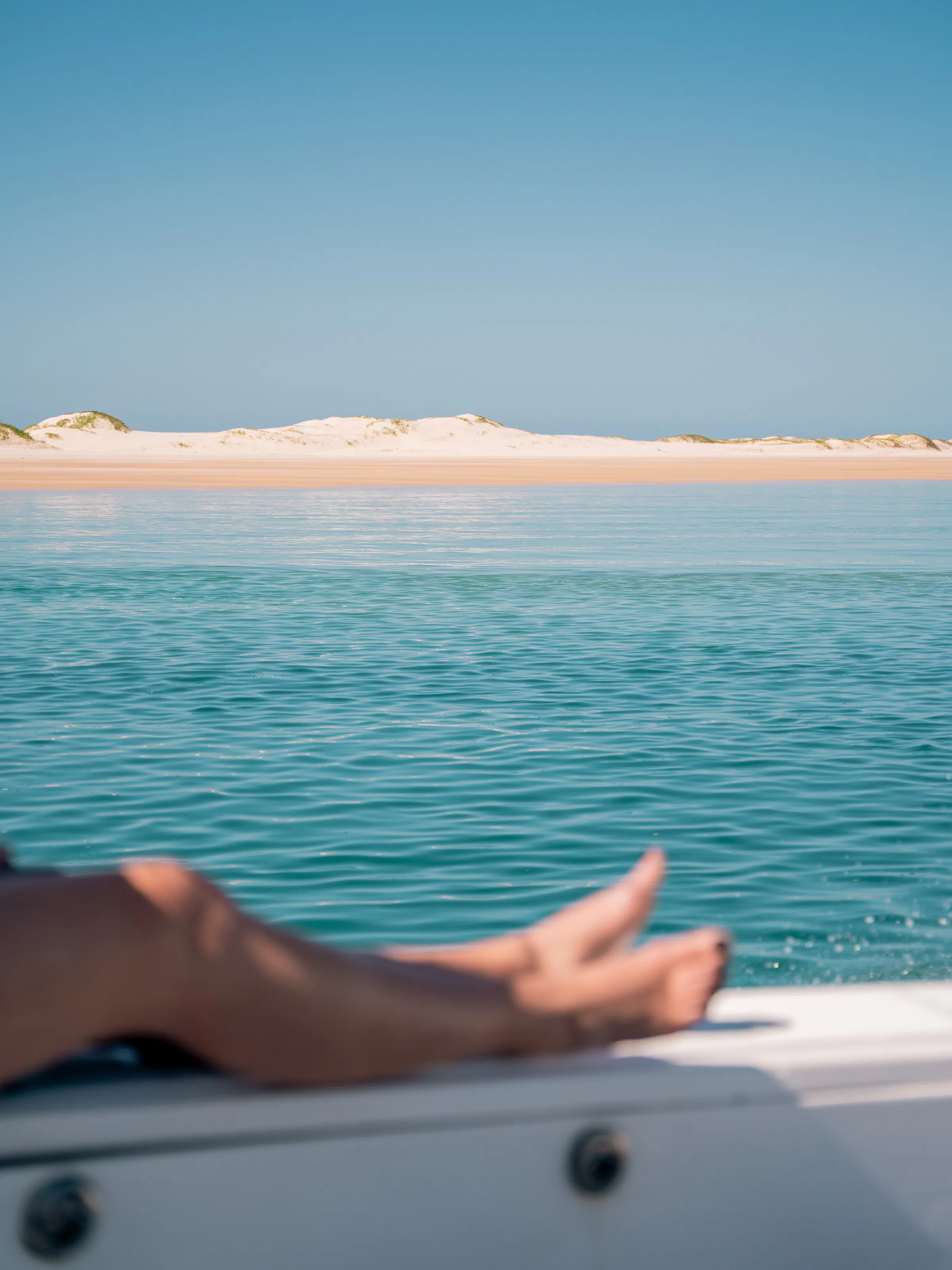 View of sand dunes from a boat on Bazaruto Archipelago waters, Mozambique