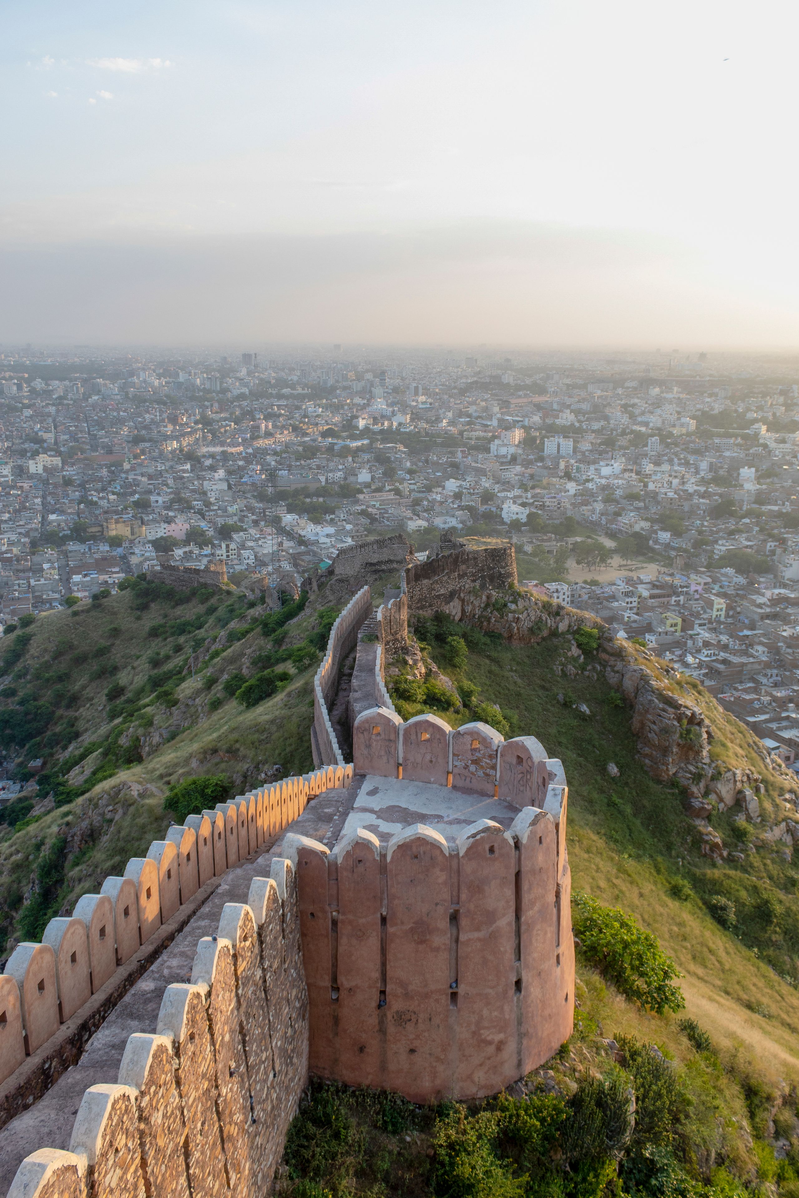 Ancient fort walls overlooking Jaipur city at sunset, Rajasthan