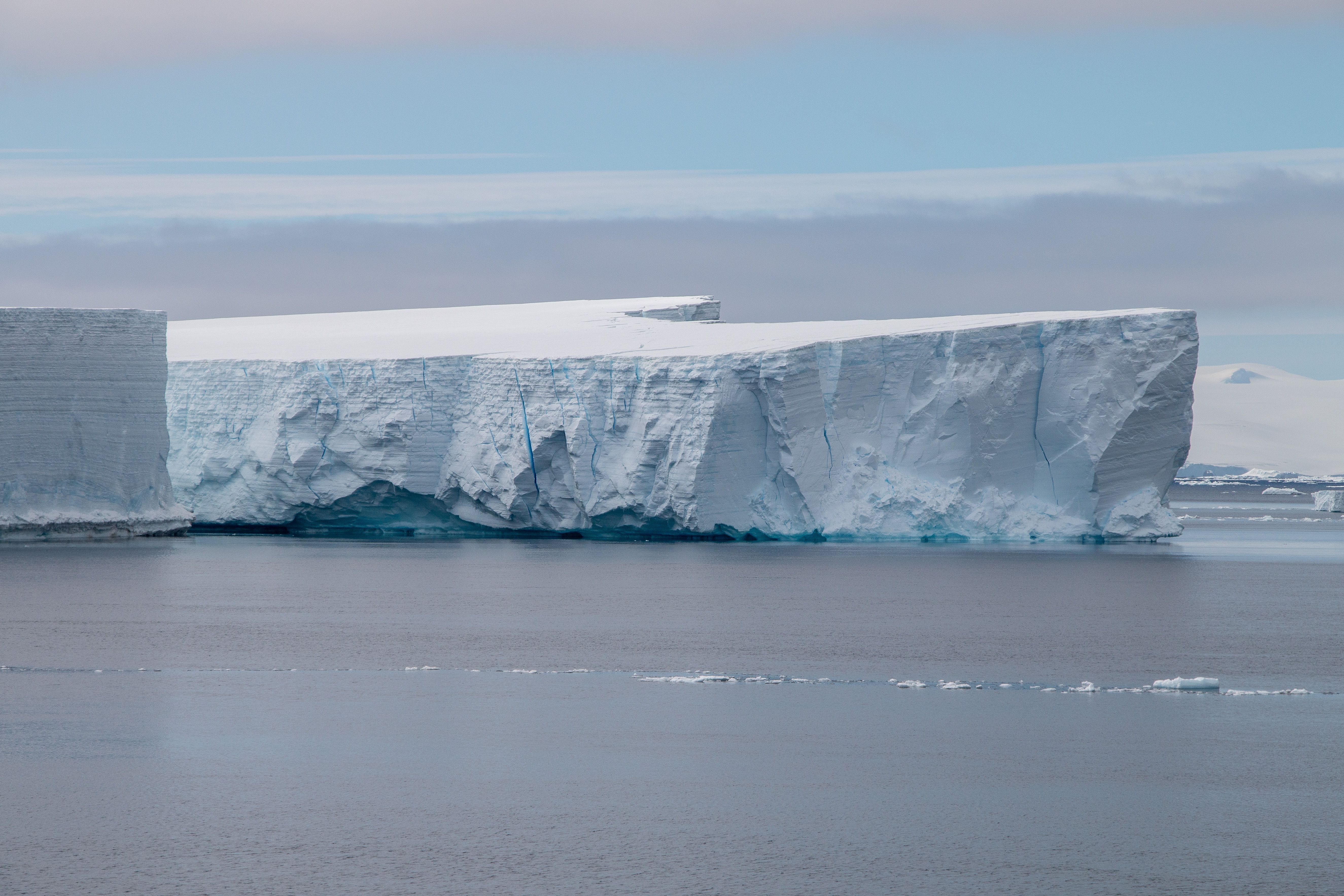 Tabular iceberg floating in calm waters off Antarctica
