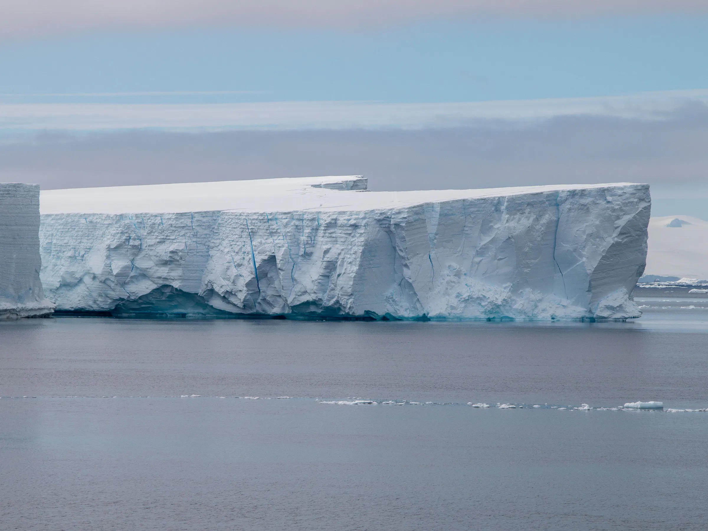 Tabular iceberg floating in calm waters off Antarctica