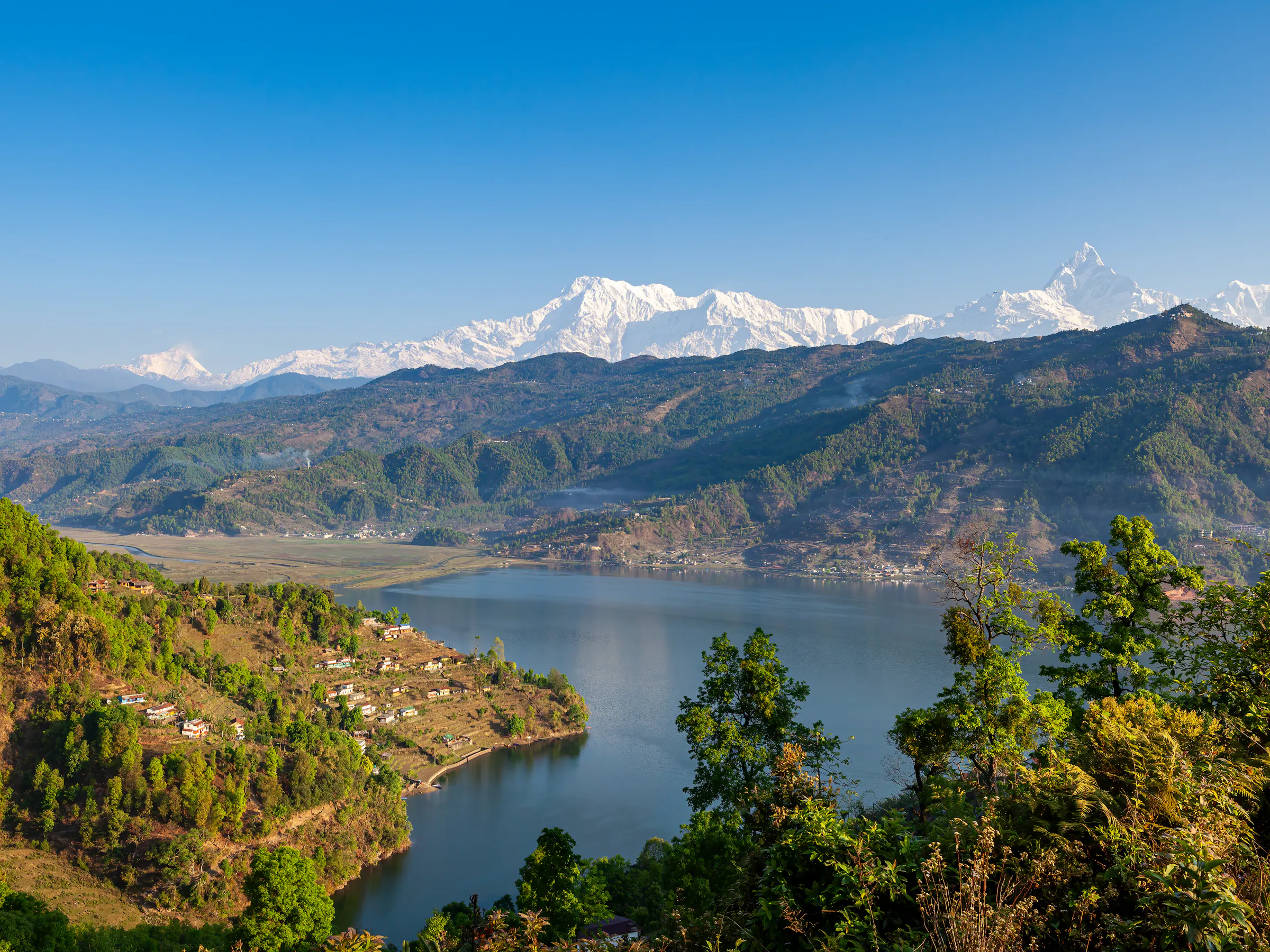 Phewa Lake with snow-capped Annapurna and Machhapuchhre, Pokhara Nepal