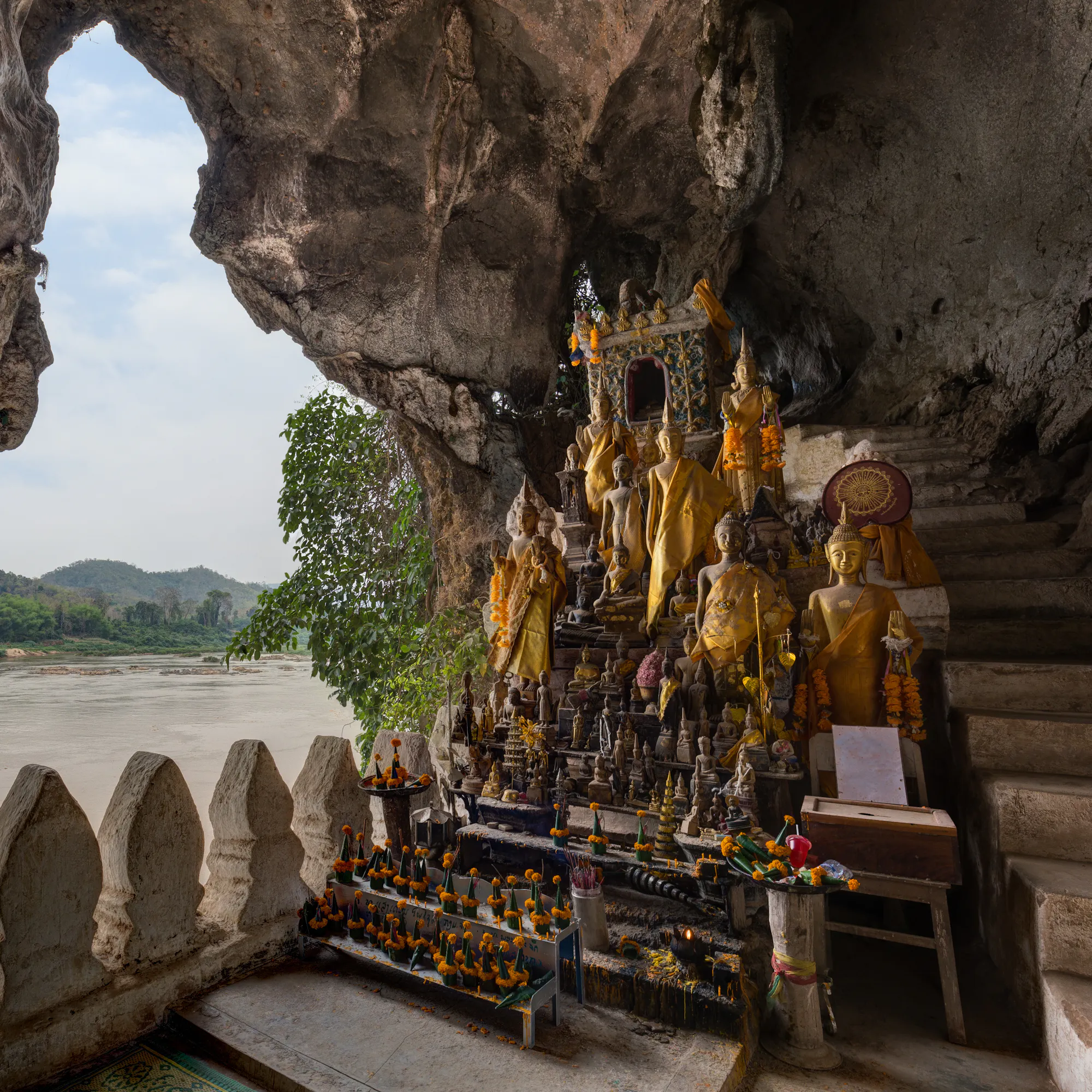 Golden Buddha statues in Pak Ou Caves, Luang Prabang Laos