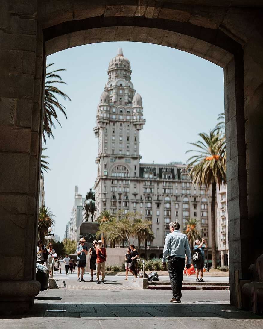 Palacio Salvo tower framed by archway in Plaza Independencia, Montevideo, Uruguay
