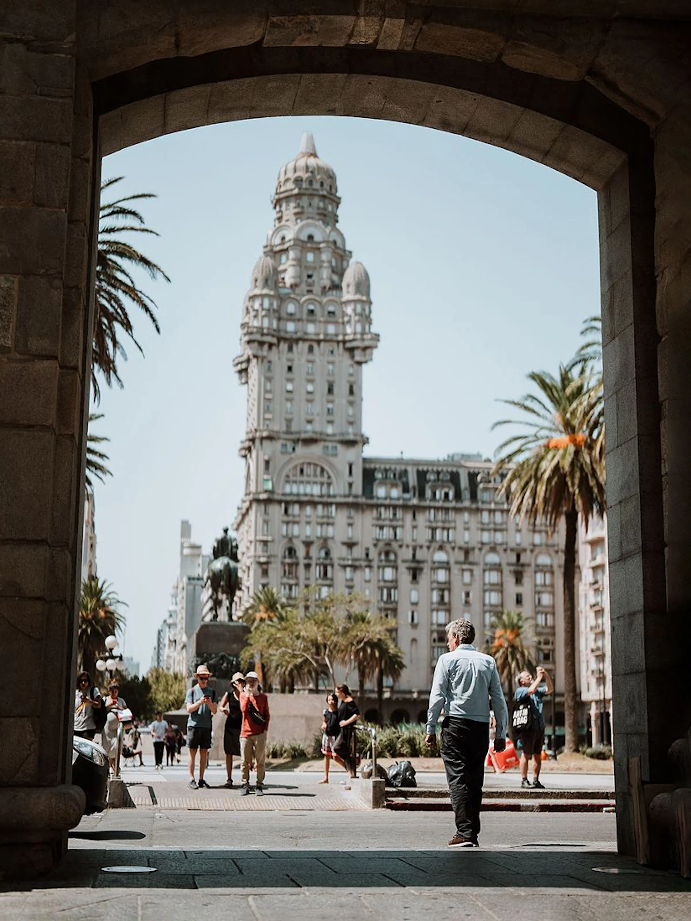 Palacio Salvo tower framed by archway in Plaza Independencia, Montevideo, Uruguay