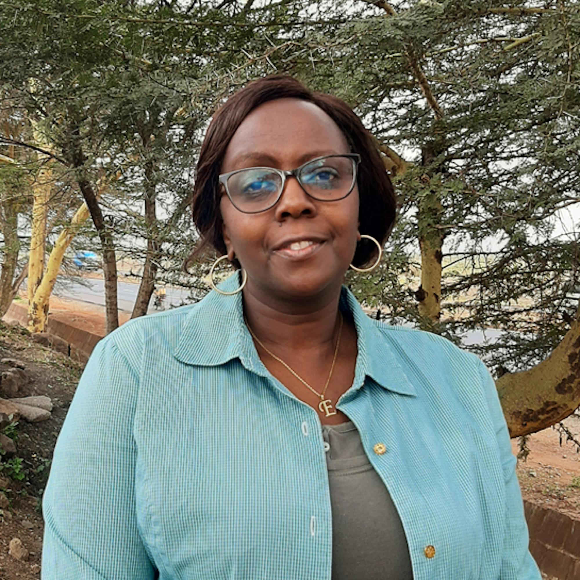 Headshot of Esther Ndirangu, Itinerary Designer at Extraordinary Journeys.