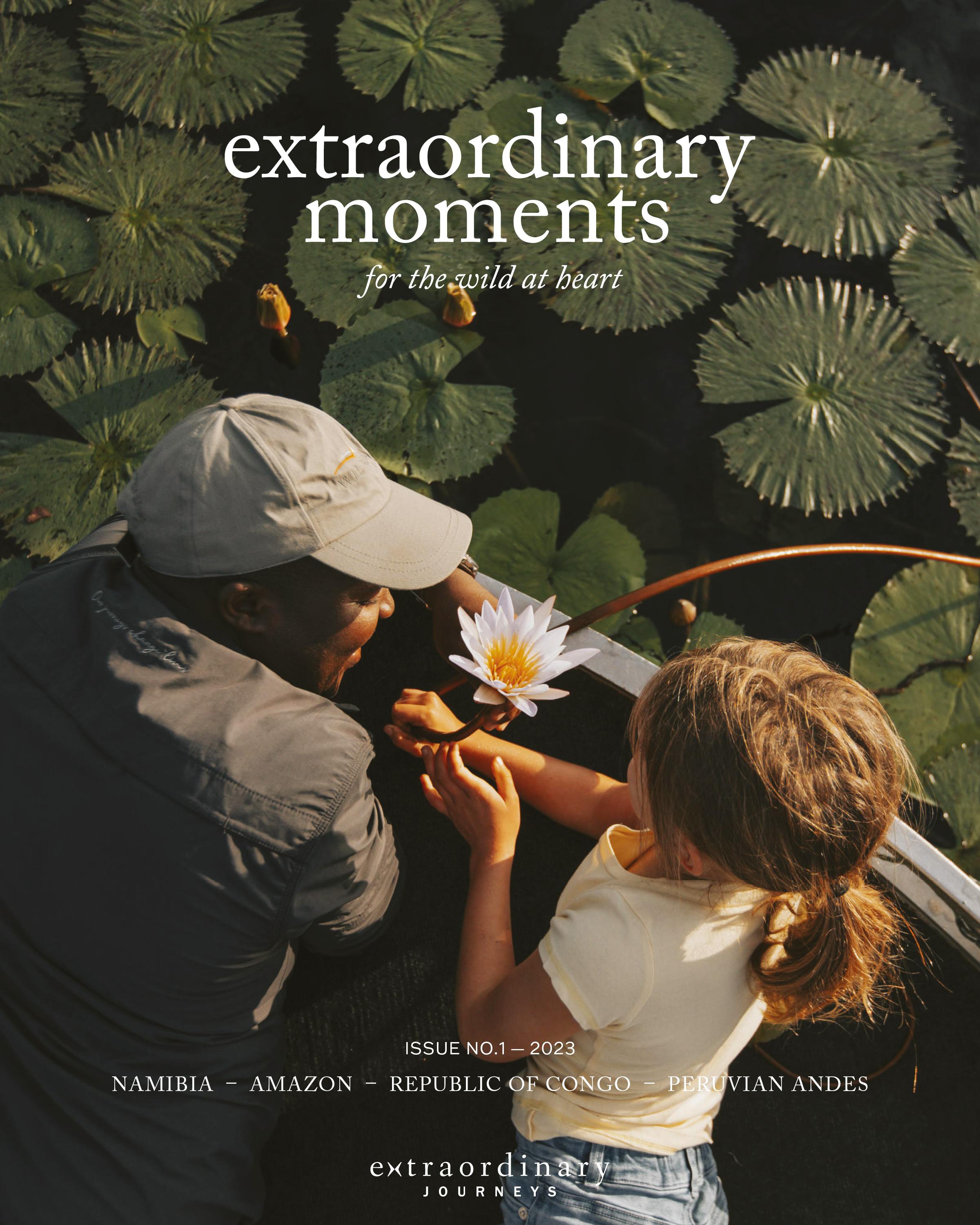 A herd of elephants stands in shallow water at golden hour. Cover text reads: “extraordinary moments – for the wild at heart.”