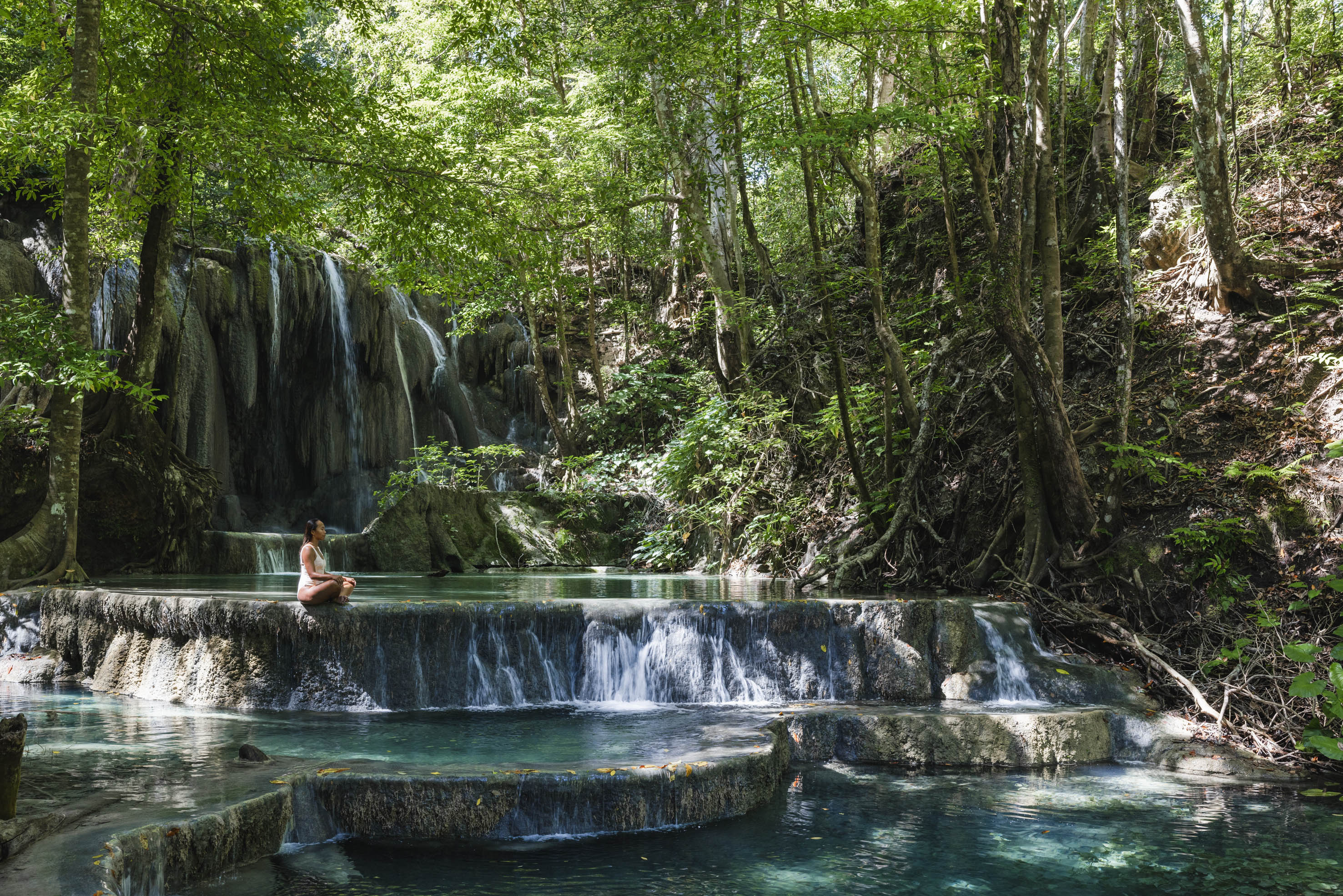 Woman sitting at the Mata Jitu waterfall